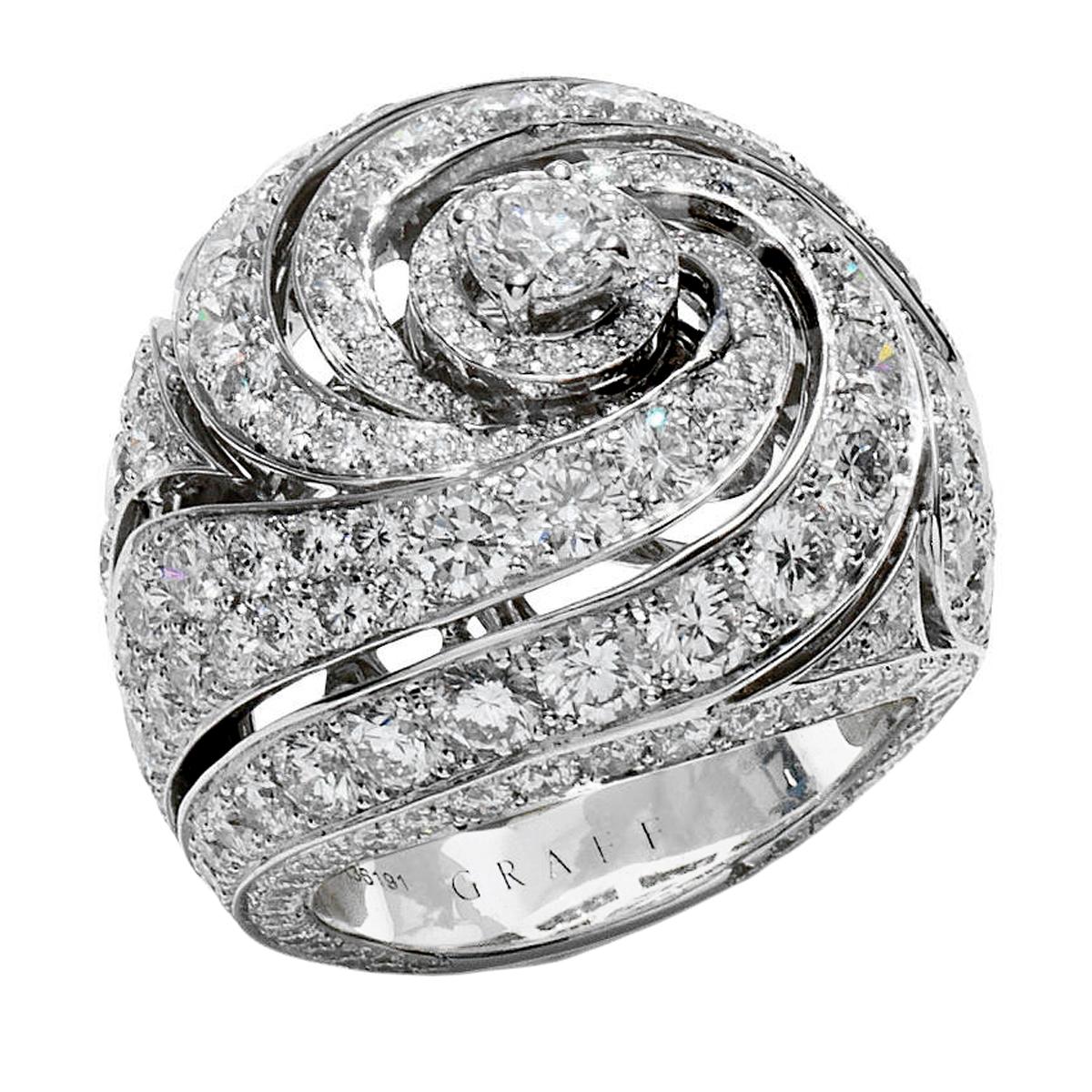 An incredible diamond ring by Graff showcasing 6.83ct of the finest round brilliant cut diamonds set in 18k white gold. This showstopping diamond cocktail ring measures a size 5 1/2 and can be resized if needed.