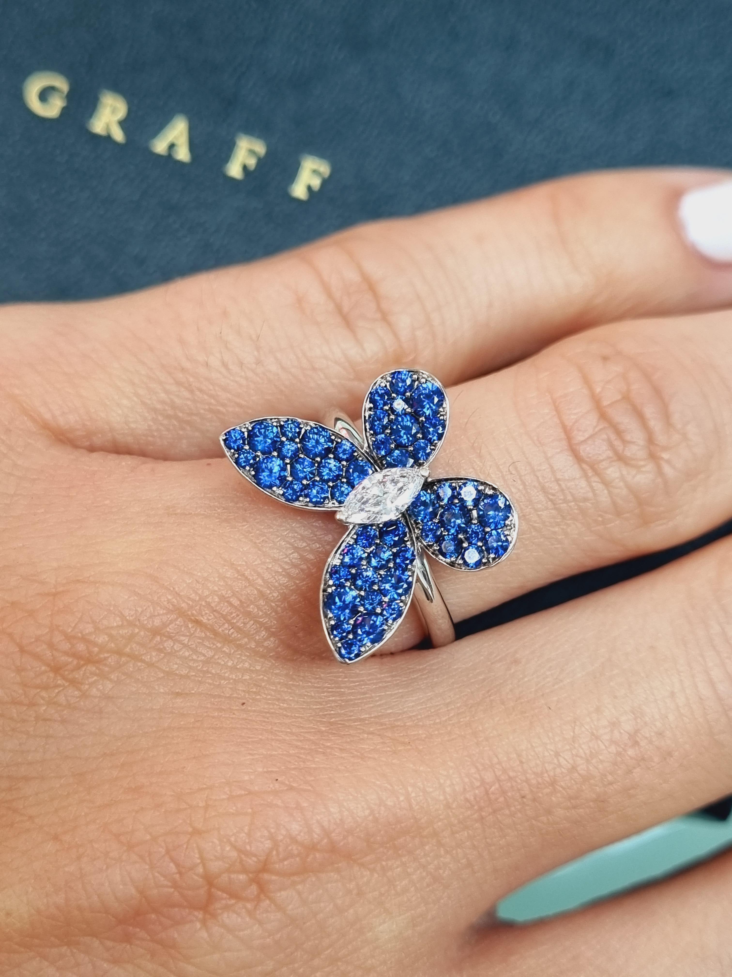 Introducing a stunning masterpiece from the renowned Graff, the Butterfly Ring crafted in exquisite 18k white gold. This ring boasts a delicate yet captivating design inspired by the elegance of butterflies. At its heart, a marquise cut diamond