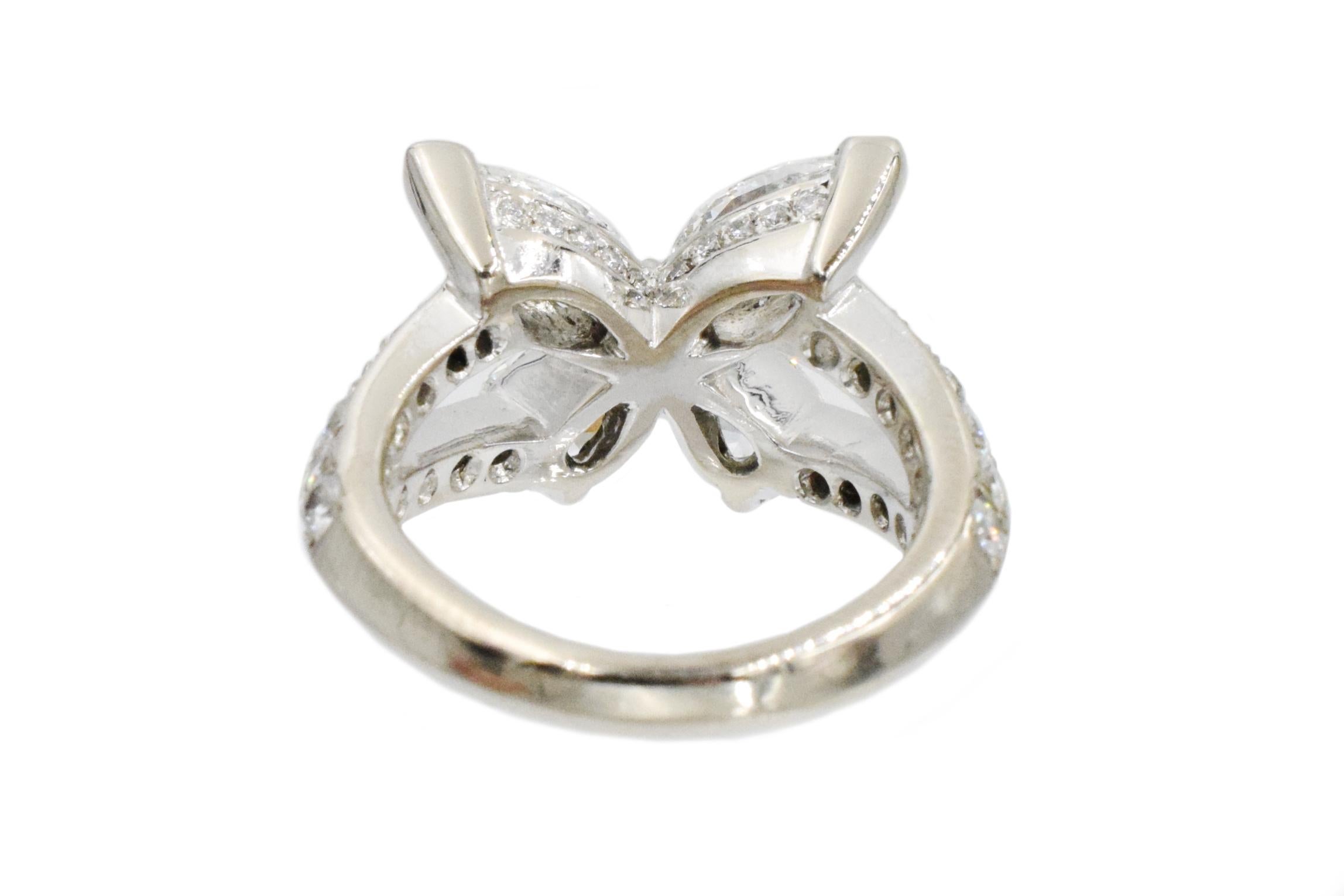 Graff Butterfly diamond ring. This butterfly motif ring has 2 pear shape and 2 marquise shape fine quality diamonds ( F/G/ VS) weighing 1.85 total carat and 48 round diamonds ( F/G/ VS) weighing 0.59 total carat all set in 18k white gold.
This ring