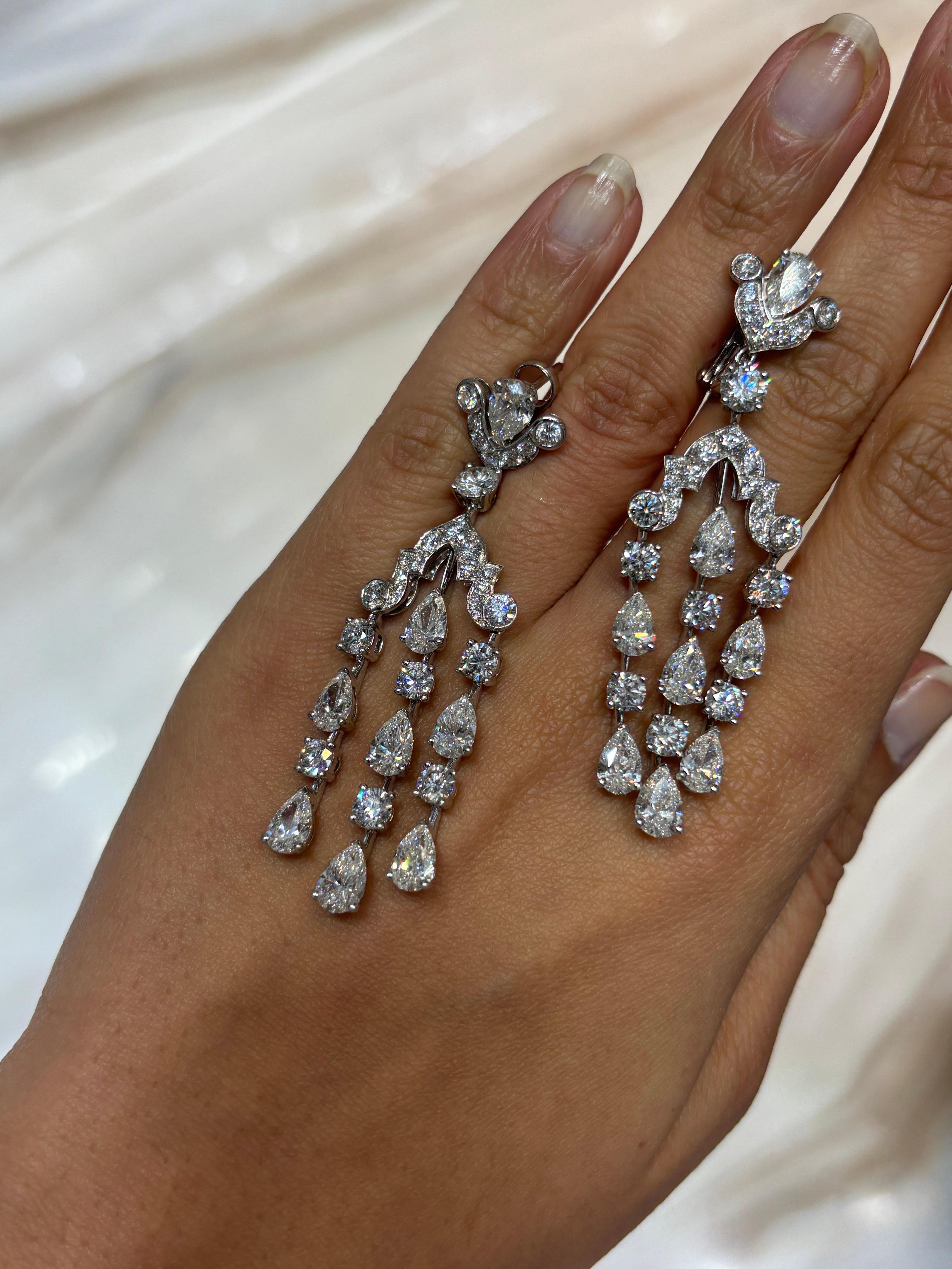 A stunning pair of original Graff signed chandelier earrings from with Sotheby’s auction papers, White Diamonds weighing approximately 15 carats, G-H color, VS quality. 
We provide free shipping, and accept returns. 
Please message us for more