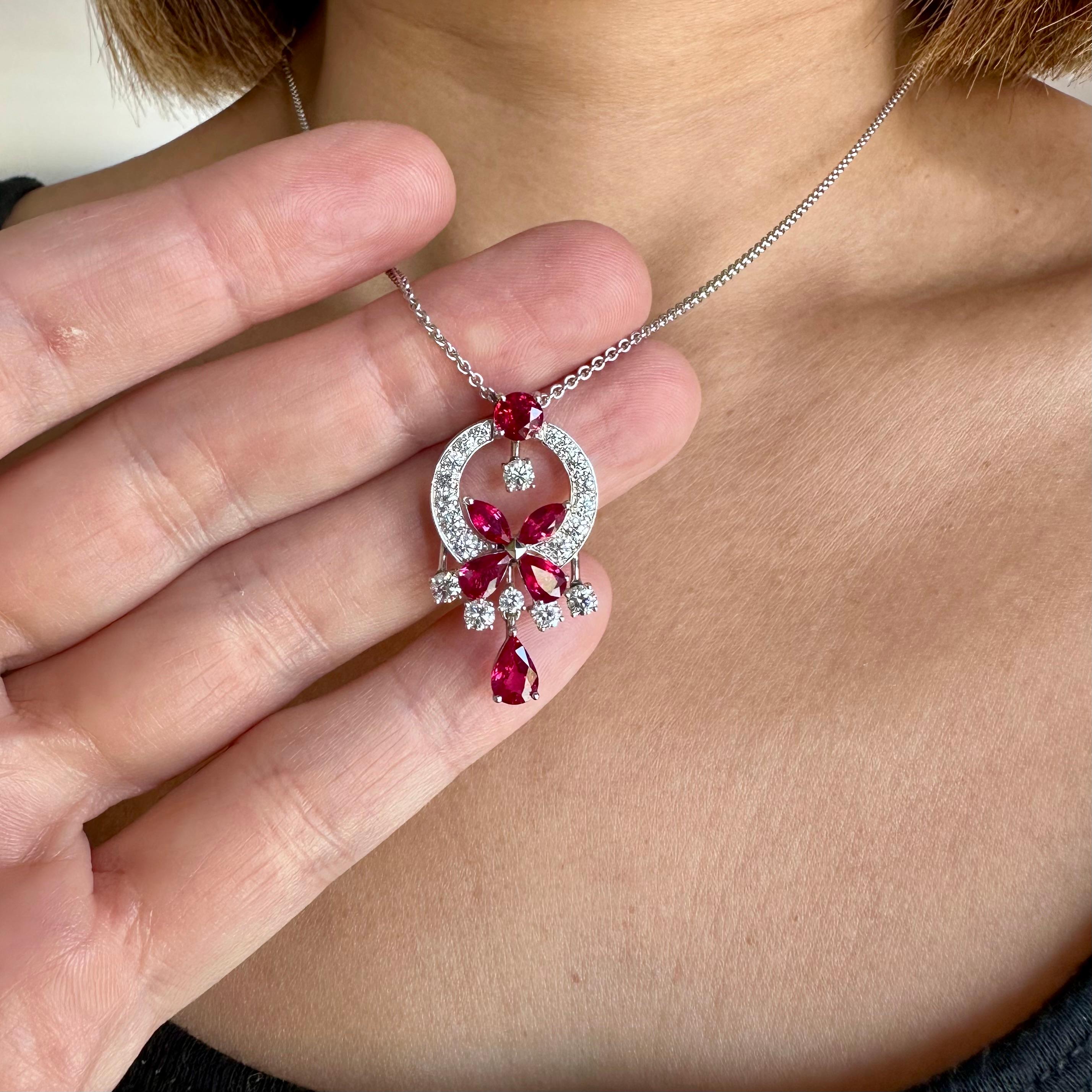By Lawrence Graff 
Classic butterfly Necklace with Ruby and Diamond Pendant Necklace.  18 karat white gold. Diamonds 1.28 cts  
Ruby is 2.83 cts  
The pendant comes on a Signed Graff 18 k White Gold 17 inch Chain. 
Dimensions: length is 1.25 by
