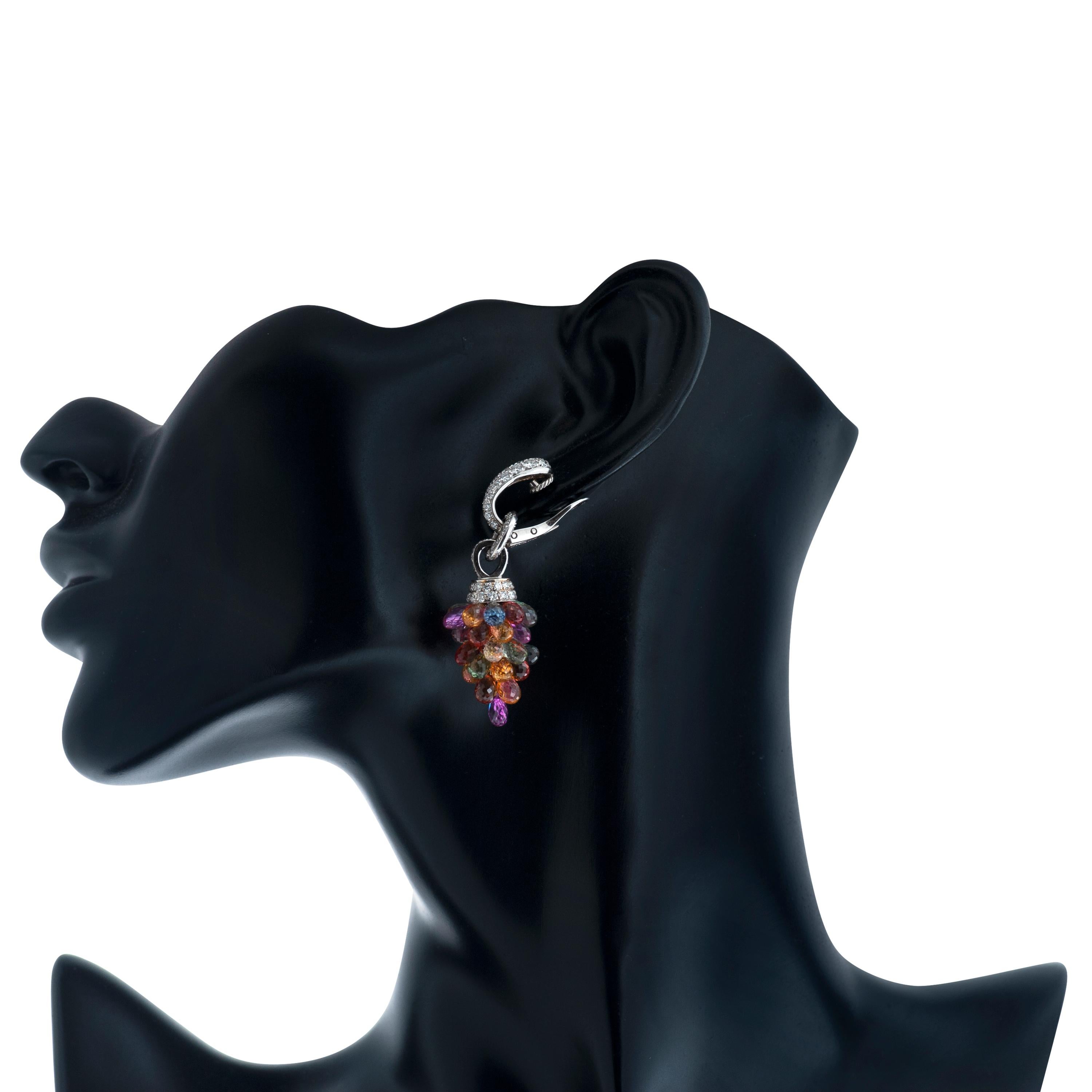 This pair of Graff dangle earrings features briolette sapphires in multiple hues of blue, green, yellow, orange, pink and purple.  As well as approximately 3.20 carats of round brilliant cut diamonds F-G color and VS clarity. 

Approximately 2