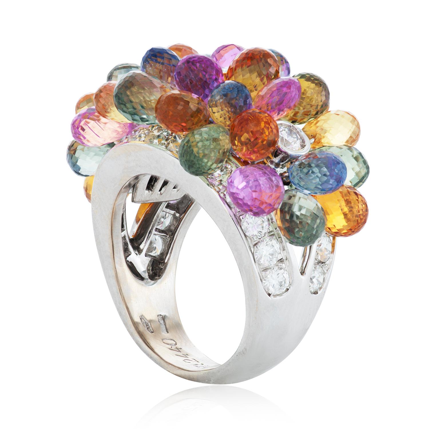 This Graff ring features briolette sapphires in multiple hues of blue, green, yellow, orange and pink.  As well as approximately 1.90 carats of round brilliant cut diamonds F-G color and VS clarity. 

16mm wide.
size 5.75.
Numbered and signed Graff.