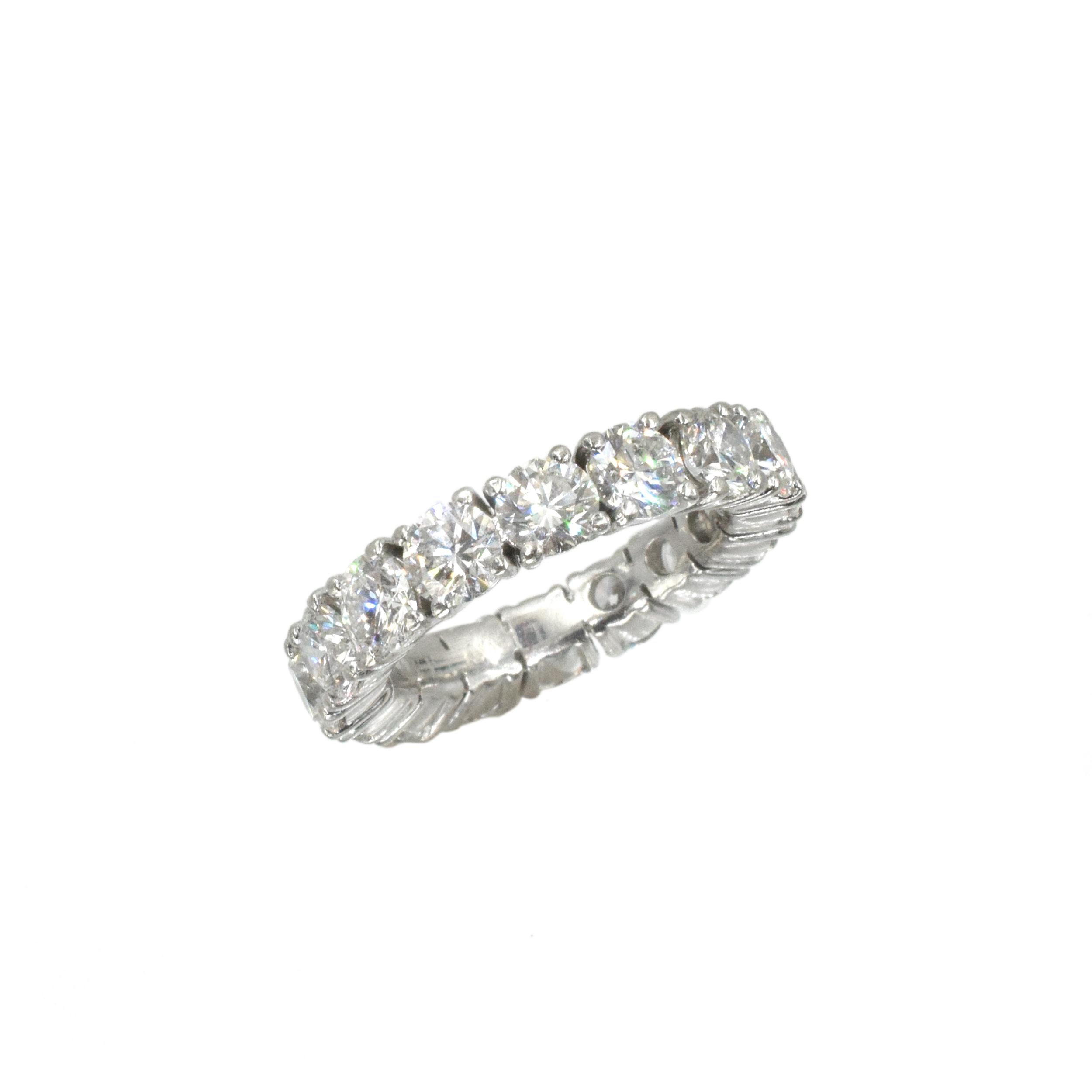 Graff Diamond and Platinum Eternity Wedding Band This eternity wedding band has 16 round brilliant cut diamonds (Color: F/G, Clarity: VS+) weighing a total of 4.89 carats all in 4 prong platinum setting. Finger Size: 5.75
.Comes with a copy of the