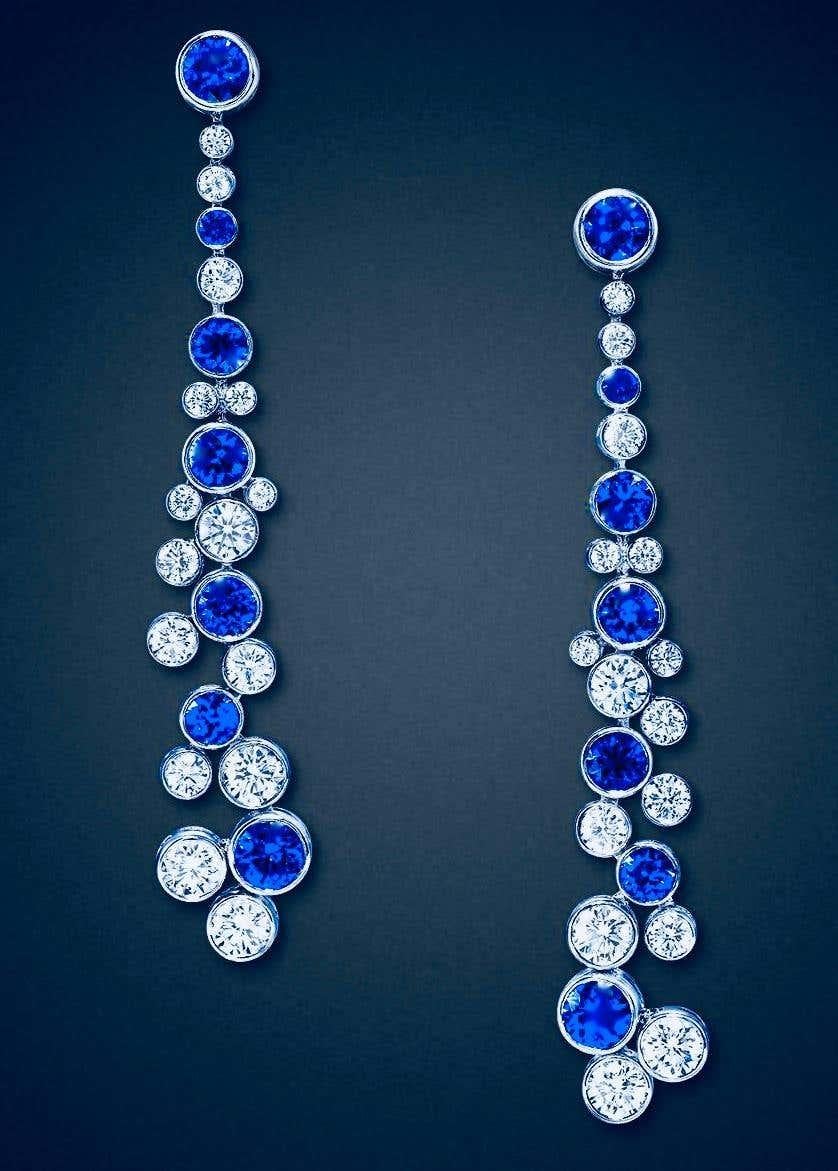 These magnificent earrings from the legendary jewelry house of Graff London possesses collection quality stones: 14 very fine vivid blue sapphires and 30 very fine white, colorless, diamonds. We estimate that there is 4.85 carats of natural