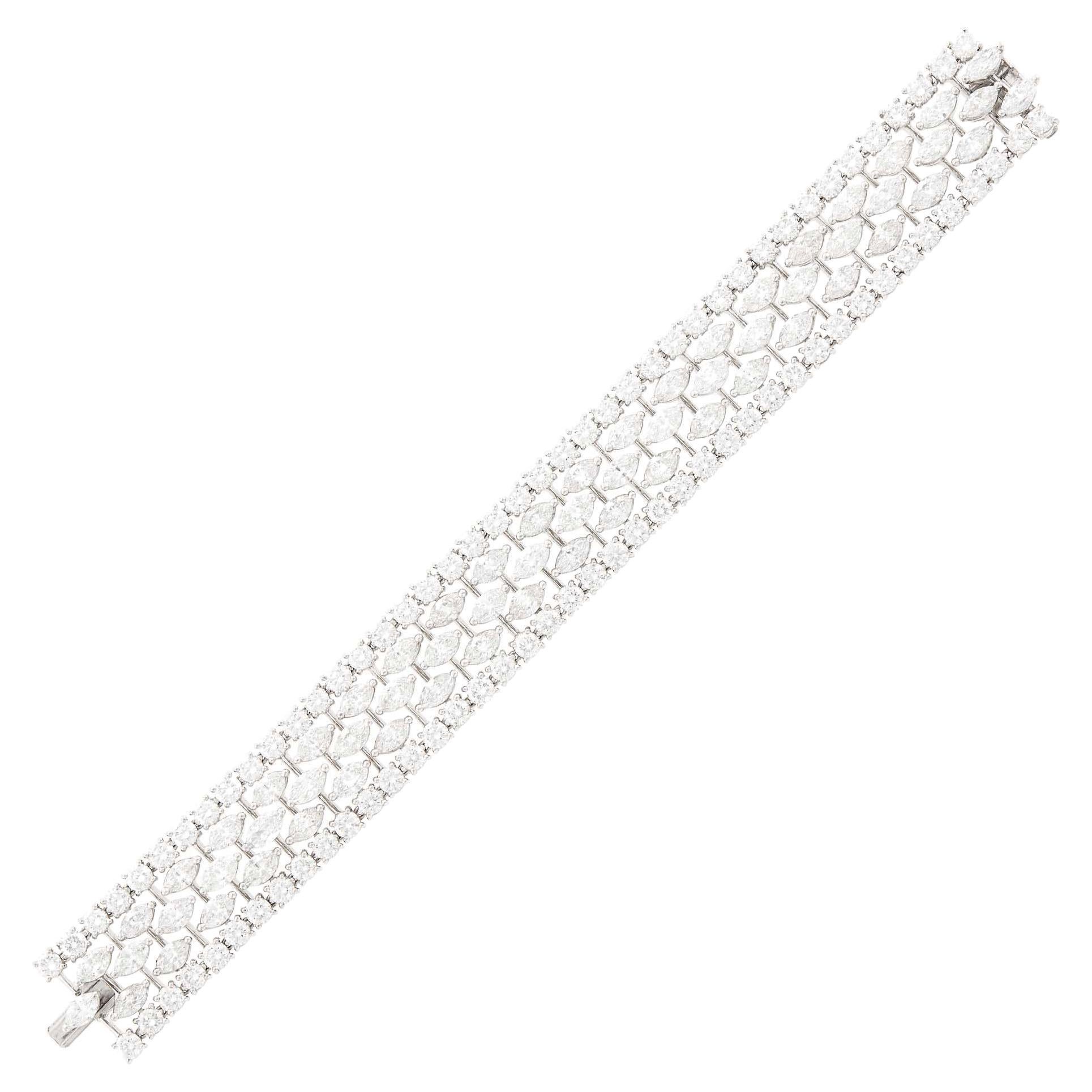 GRAFF  Platinum and Diamond Bracelet This bracelet has centering three rows of 63 marquise shaped diamonds on slender bands, edged by 84 round diamonds, totaling approx. 36.15 carats
Fine color and clarity diamonds , signed GRAFF, no. XXXX
 Length 7