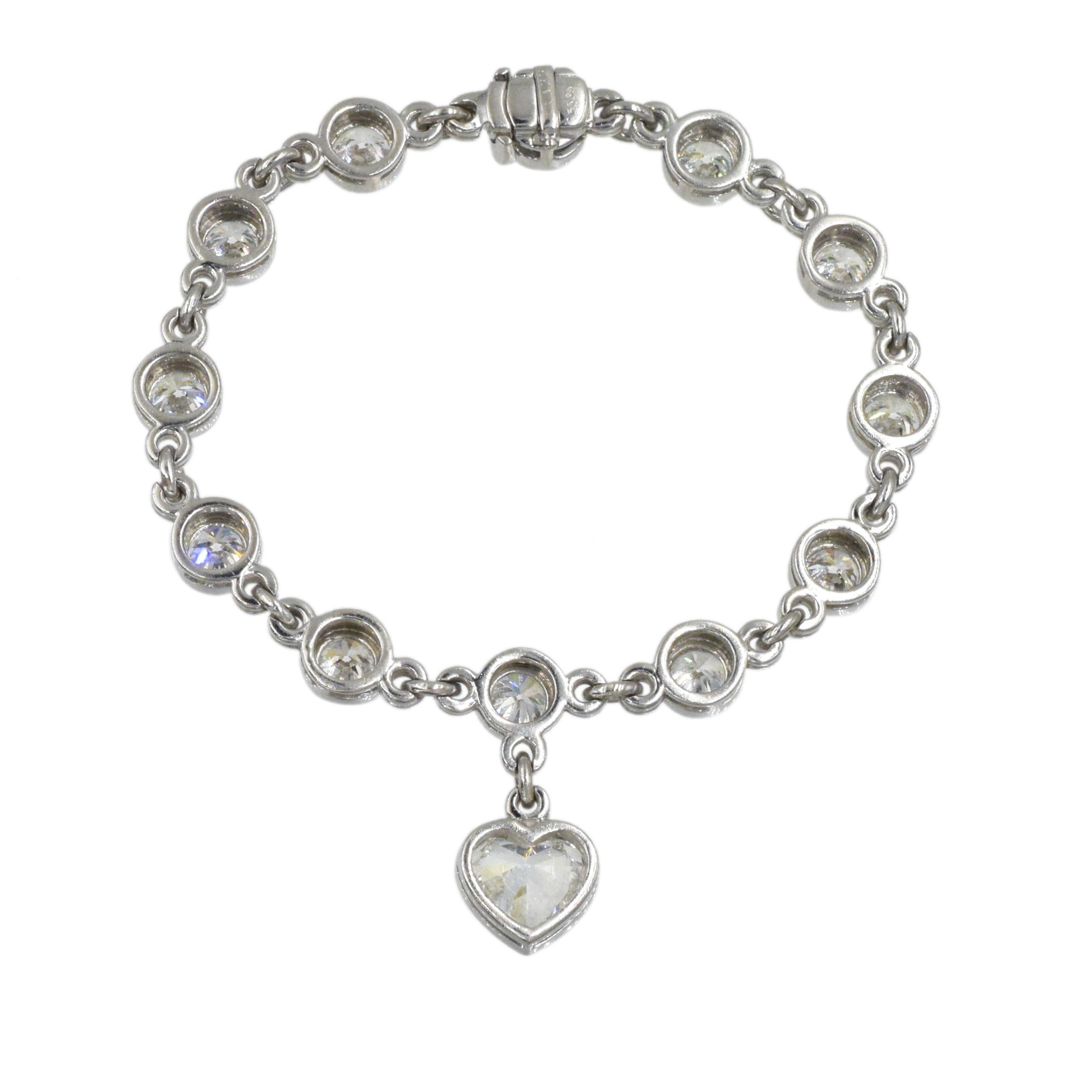 Graff Diamond Charm Bracelet In Platinum. 
The bracelet consist of 12 round brilliant cut diamonds with weight of approximately 8.00 carats, linked together, accented with heart-shaped diamond charm with weight of approximately 2.00ct. Color of the