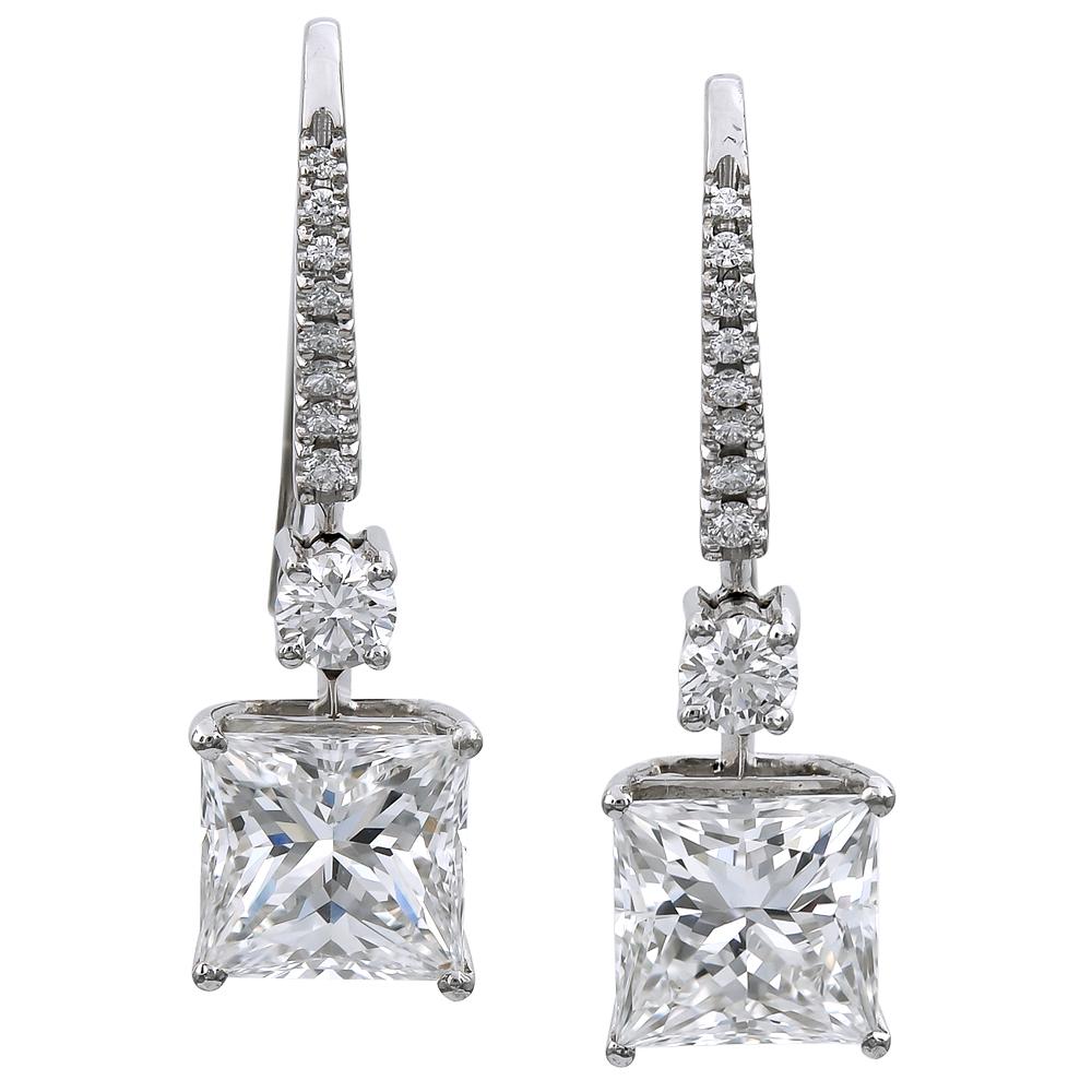 From the legendary Graff collection, these magnificent white Princess cut diamond earrings with white round diamond tops on white rounds diamond pave French wires possesses distinctive quality stones.

2 striking square modified brilliant diamonds