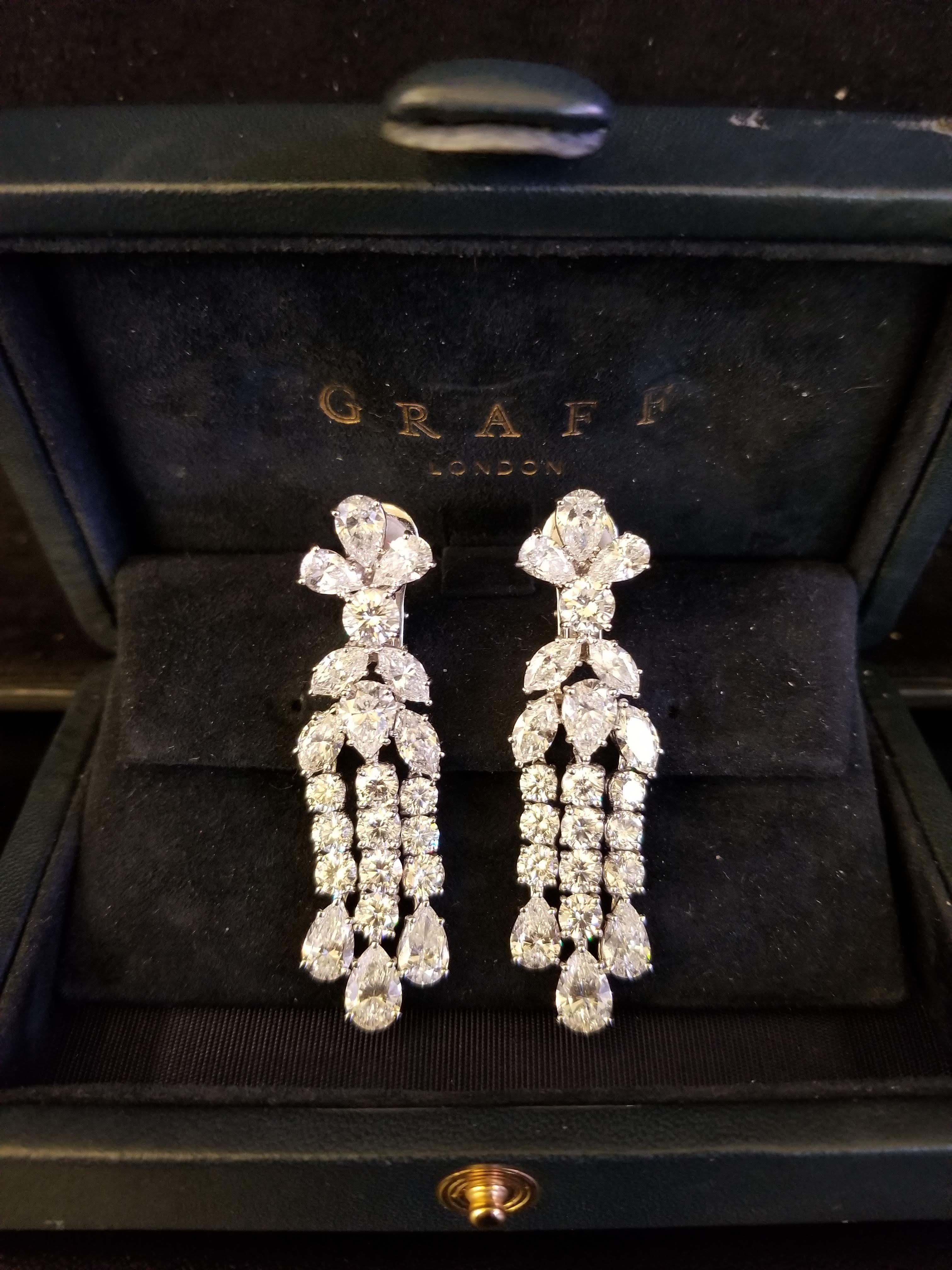 Diamond Waterfall Earrings by GRAFF
This pair of earrings has 14 pear shaped diamonds weighing 11.03 tcw , 8 marquise cut diamonds weighing 4.17tcw, and 22 round diamonds weighing 7.68tcw. The diamonds are colorless and VS+ clarity. Signed Graff and