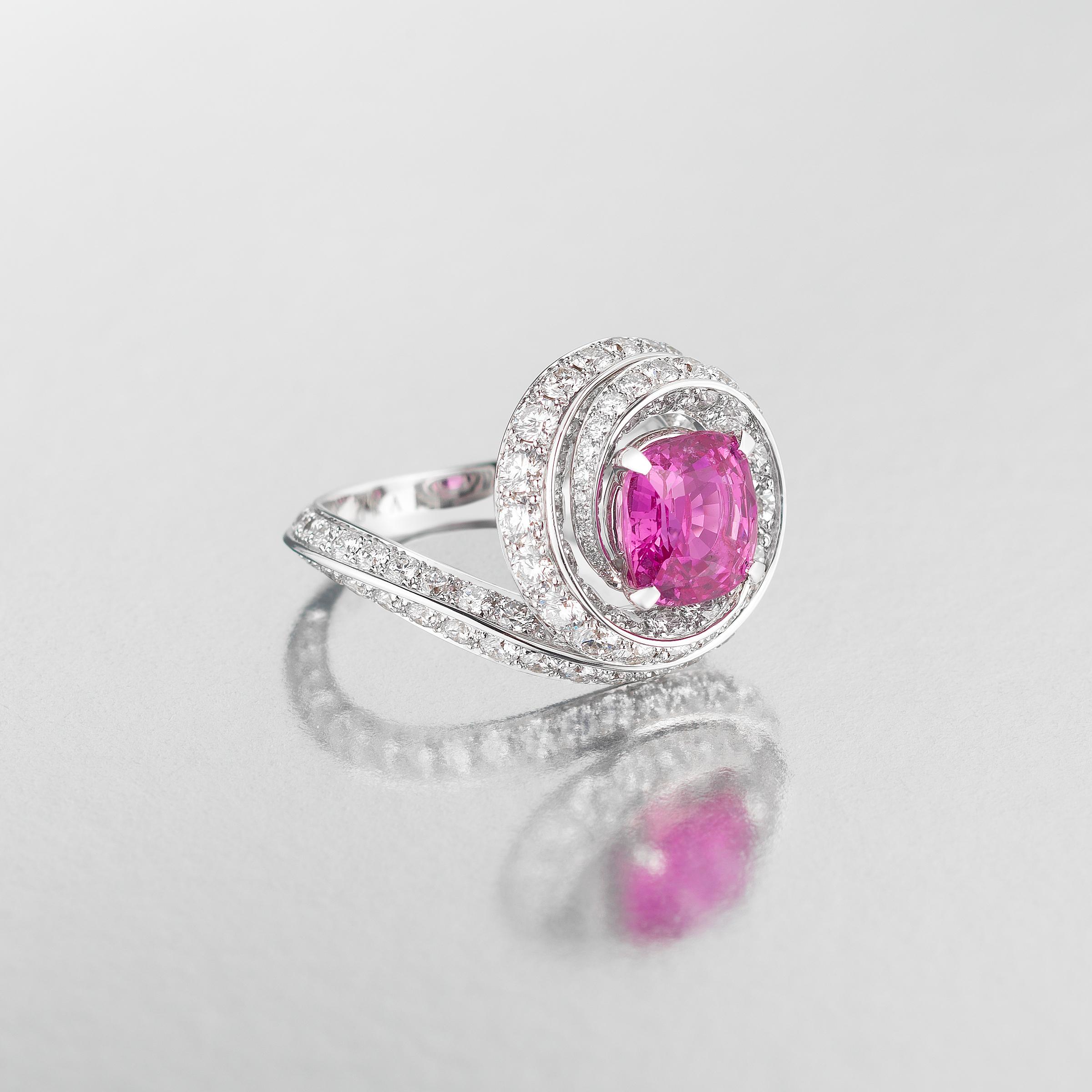 Exquisite one-of-a-kind pink sapphire and diamond ring by the famous Graff of London set in 18 karat white gold. The ring showcases at its center large, 3.13 carat, cushion-cut natural sapphire of vivid pink hue. A masterfully crafted double-layer