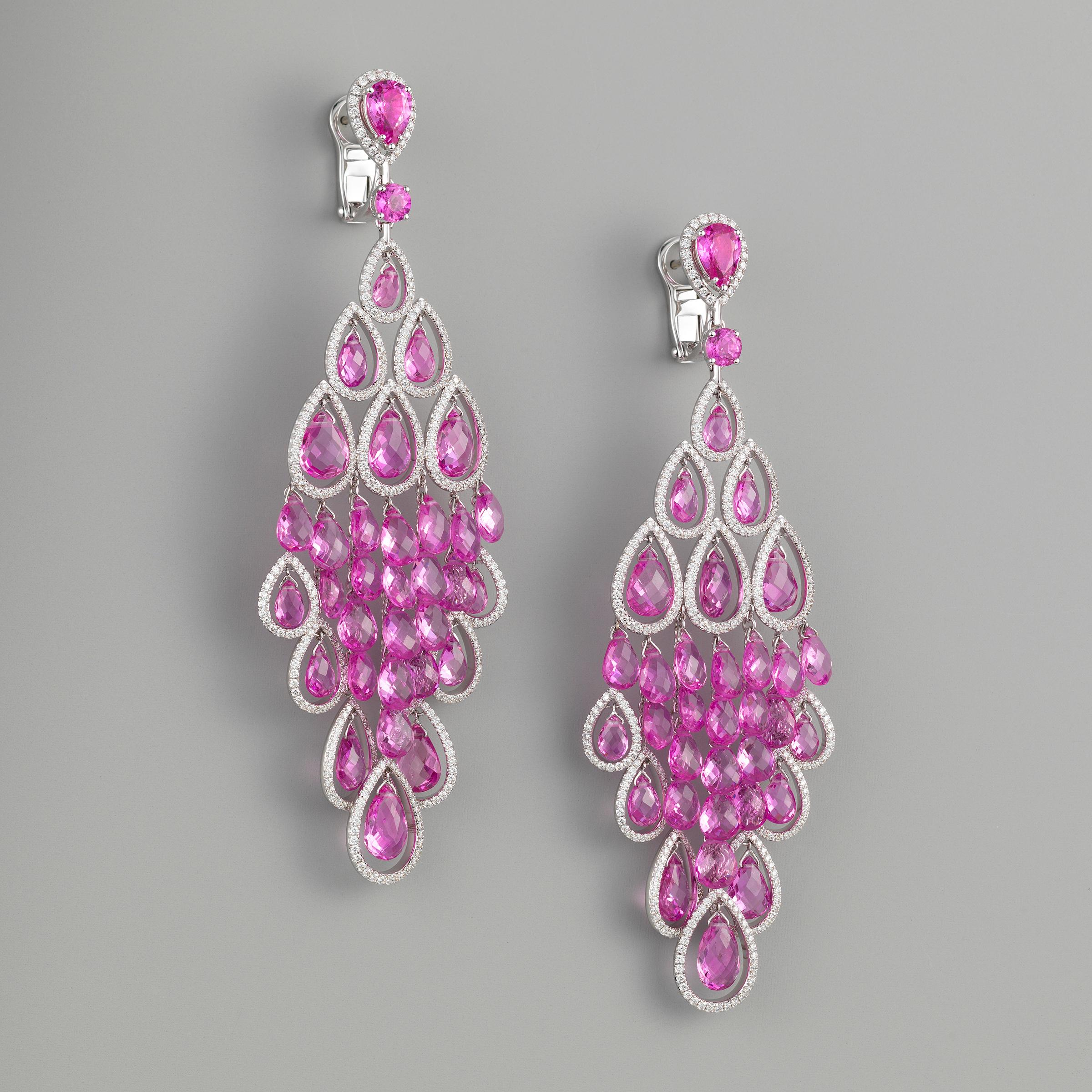 Exceptional Graff chandelier earrings bursting with vibrant style and showcasing approximately 57 carats of vivid natural pink sapphires and 4 carats of fine white diamonds (F to G color), all flawlessly set in 18 karat white gold. The earrings are