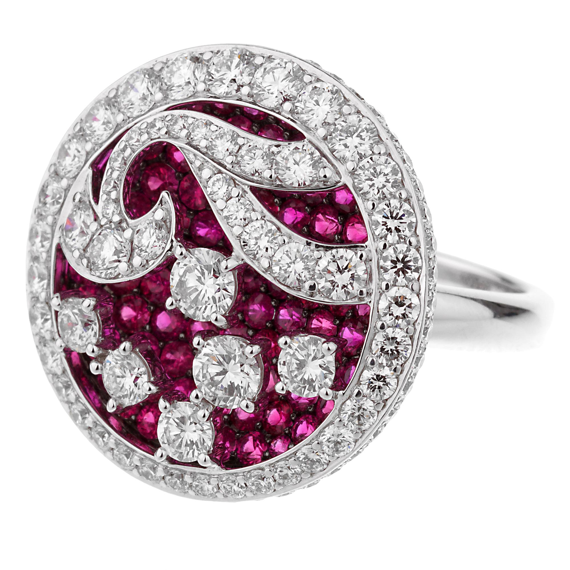 A magnificent Graff cocktail ring showcasing 2.39cts of the finest round brilliant cut diamonds atop of 2.28ct of rubies set in 18k white gold. The ring measures a size 5 1/2 and can be resized if needed.
