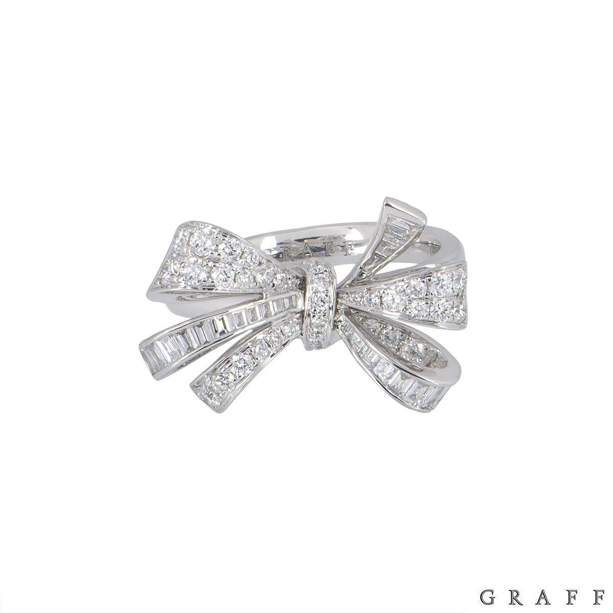 An 18k white gold diamond ring by Graff from the Bow collection. The ring features a bow design set with round brilliant cut and baguette cut diamonds. The round brilliant cut diamonds have an approximate weight of 0.70ct and the baguette cut