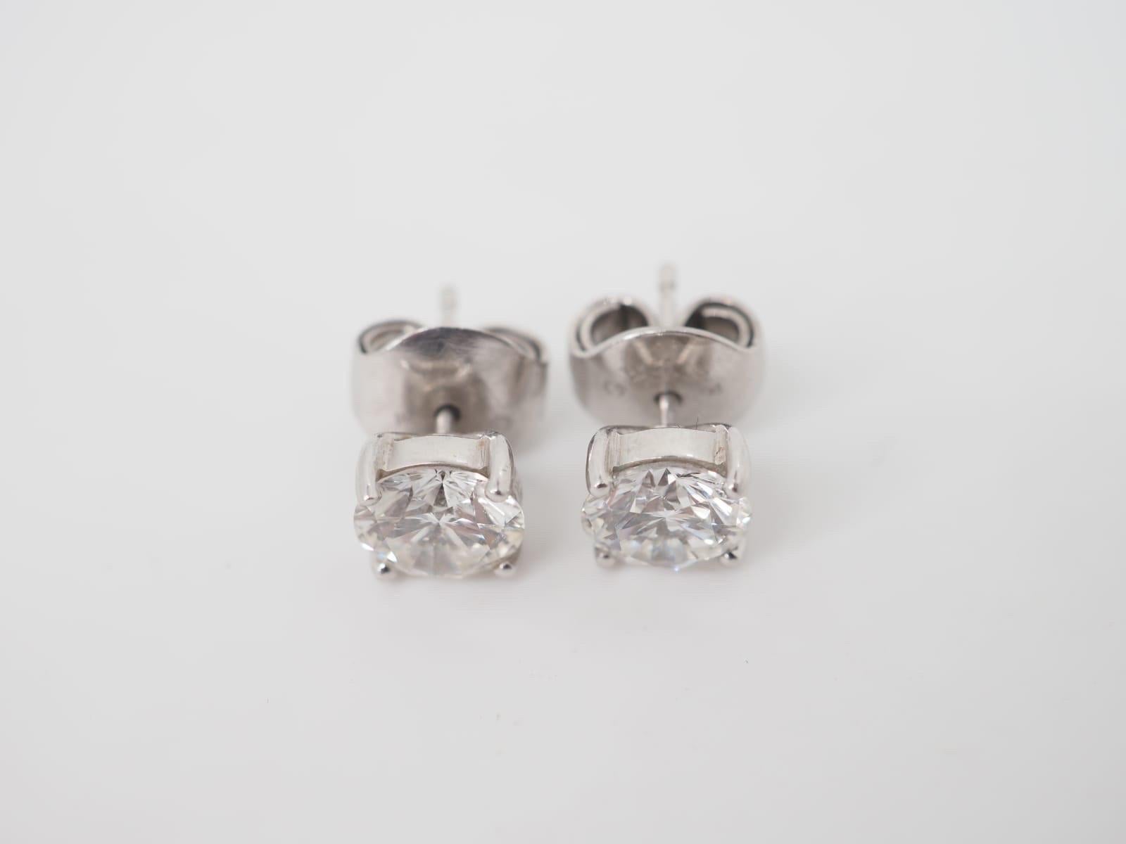 Graff diamond stud earrings crafted in 18K White Gold featuring the diamonds with a total weight 3 cts E/VS1. These beautiful earrings feature two Graff 1.5 ct E/VS1 Round Brilliant Cut Diamonds crafted in 18k White Gold stud settings with the slide