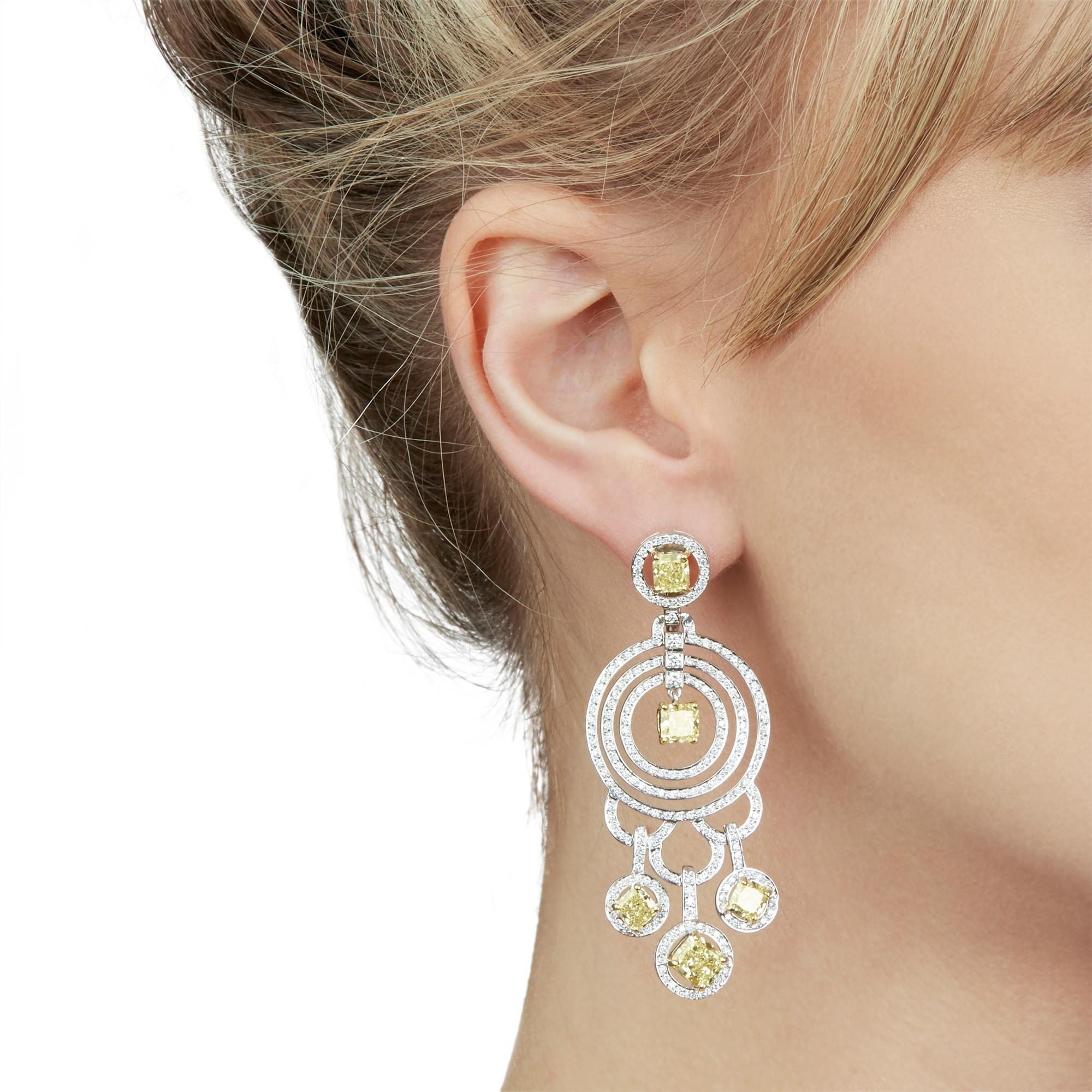 These Statement Earrings by Graff Diamonds feature 10 fancy yellow Diamonds of 8.00ct total and white Diamonds of approximately 2.00ct total, made in 18k White Gold. The two central yellow diamonds are laser inscribed and correspond with GIA reports