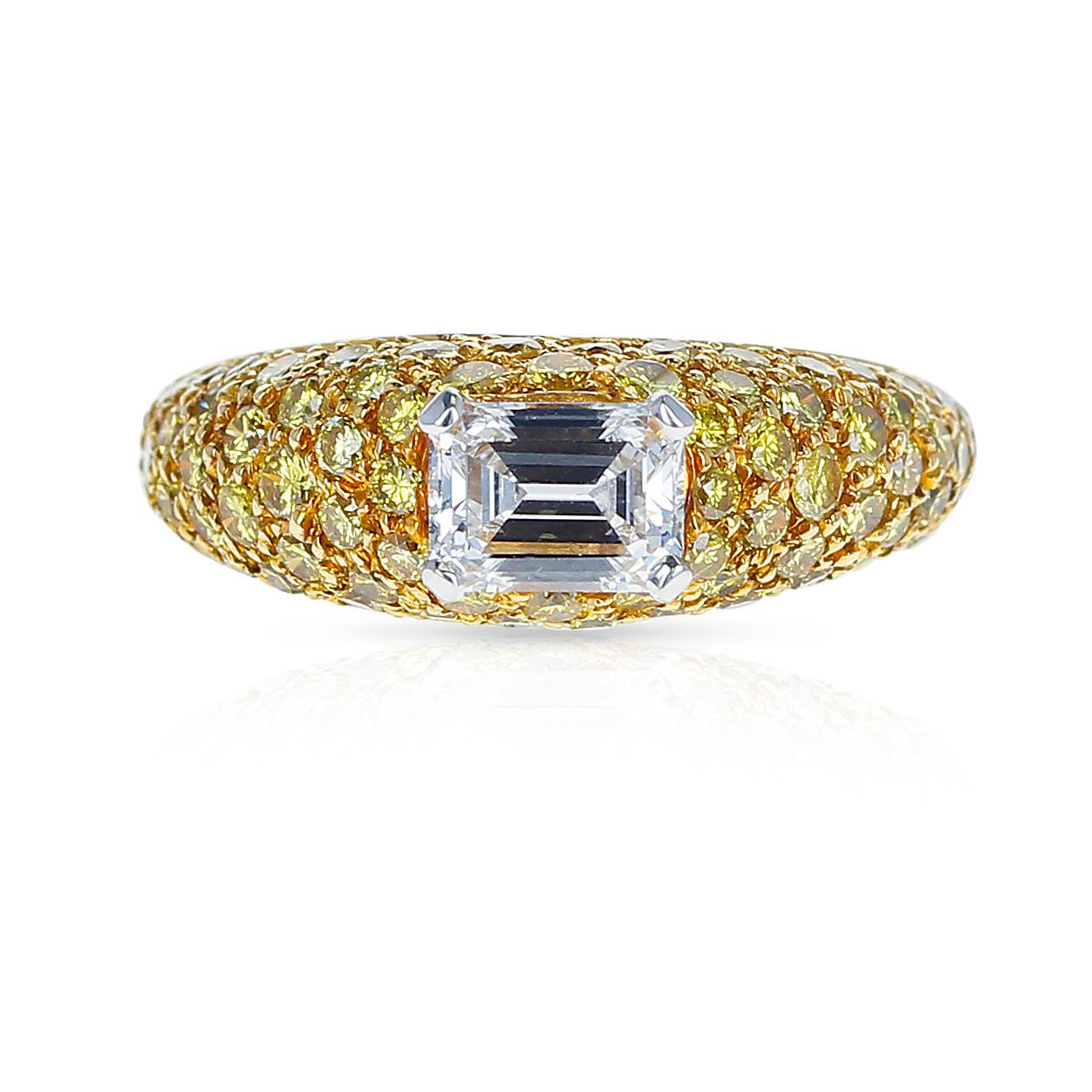 A chic emerald-cut white diamond and yellow diamond bombe ring, by Graff. This ring can be worn in both casual and formal environments. It is set with one E-Color, VVS1-Clarity, Emerald-Cut Diamond, weighing 0.80 carats, accented with 76 round