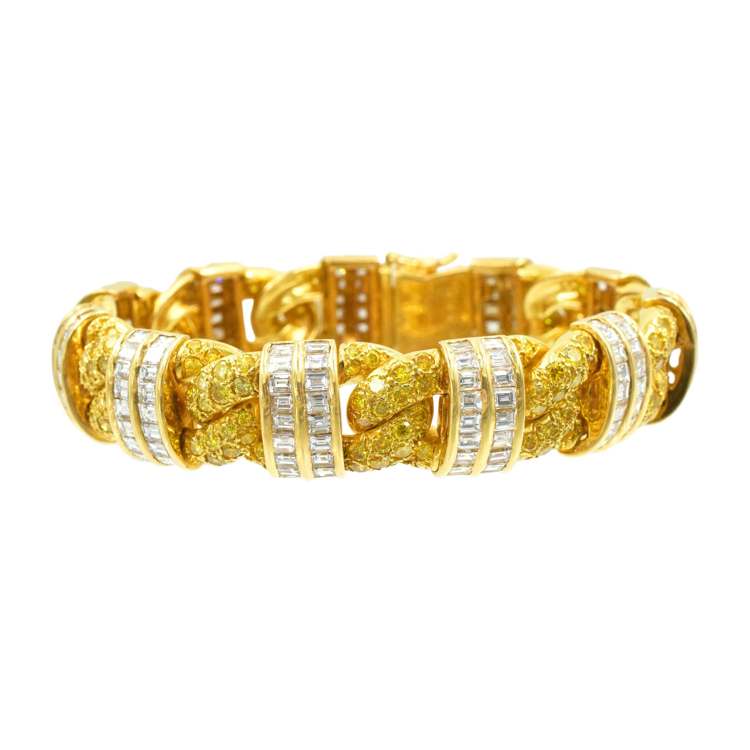 GRAFF
 Fancy Intense Yellow and White Diamond Bracelet This bracelet has 233 fancy intense yellow diamonds weighing approximately 7 carats and 196 baguette shape diamonds weighing approximately 10 carats all set in 18k yellow gold. 
Inscribed:
