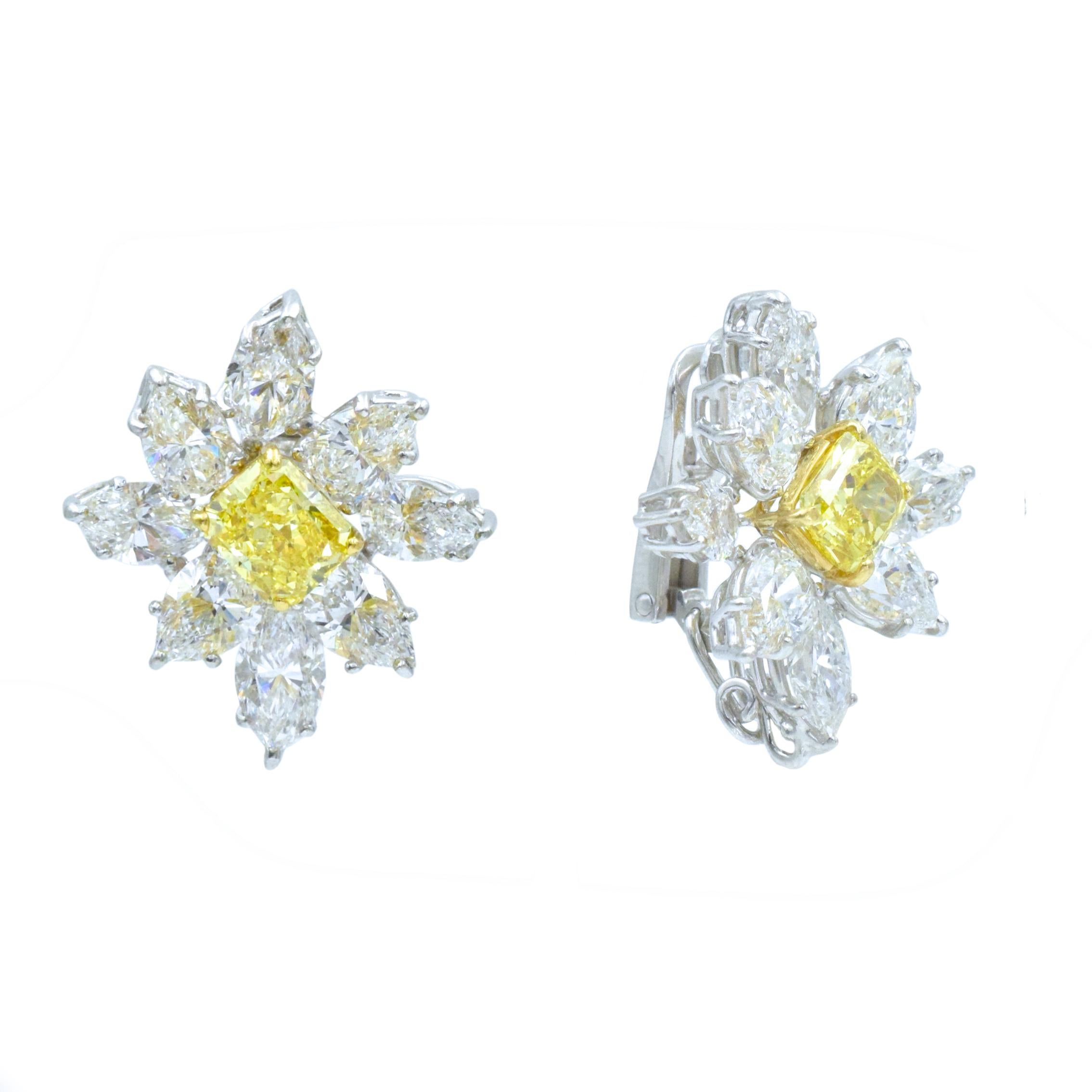 Graff, Fancy Vivid Yellow Diamond and white Damond Cluster Ear-clips  
Center set with two cut- cornered rectangular modified brilliant Fancy Vivid Yellow diamonds weighing total of 2.31 carat  (With GIA report stating 1.23 cts., Fancy Vivid Yellow,