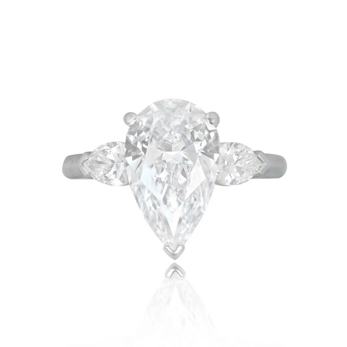 Graff platinum and diamond ring exuding elegance with a GIA-certified 3.41-carat pear-shaped center diamond (D color, IF clarity). The shoulders feature two additional pear-shaped diamonds, totaling approximately 0.60 carats. Handcrafted in platinum
