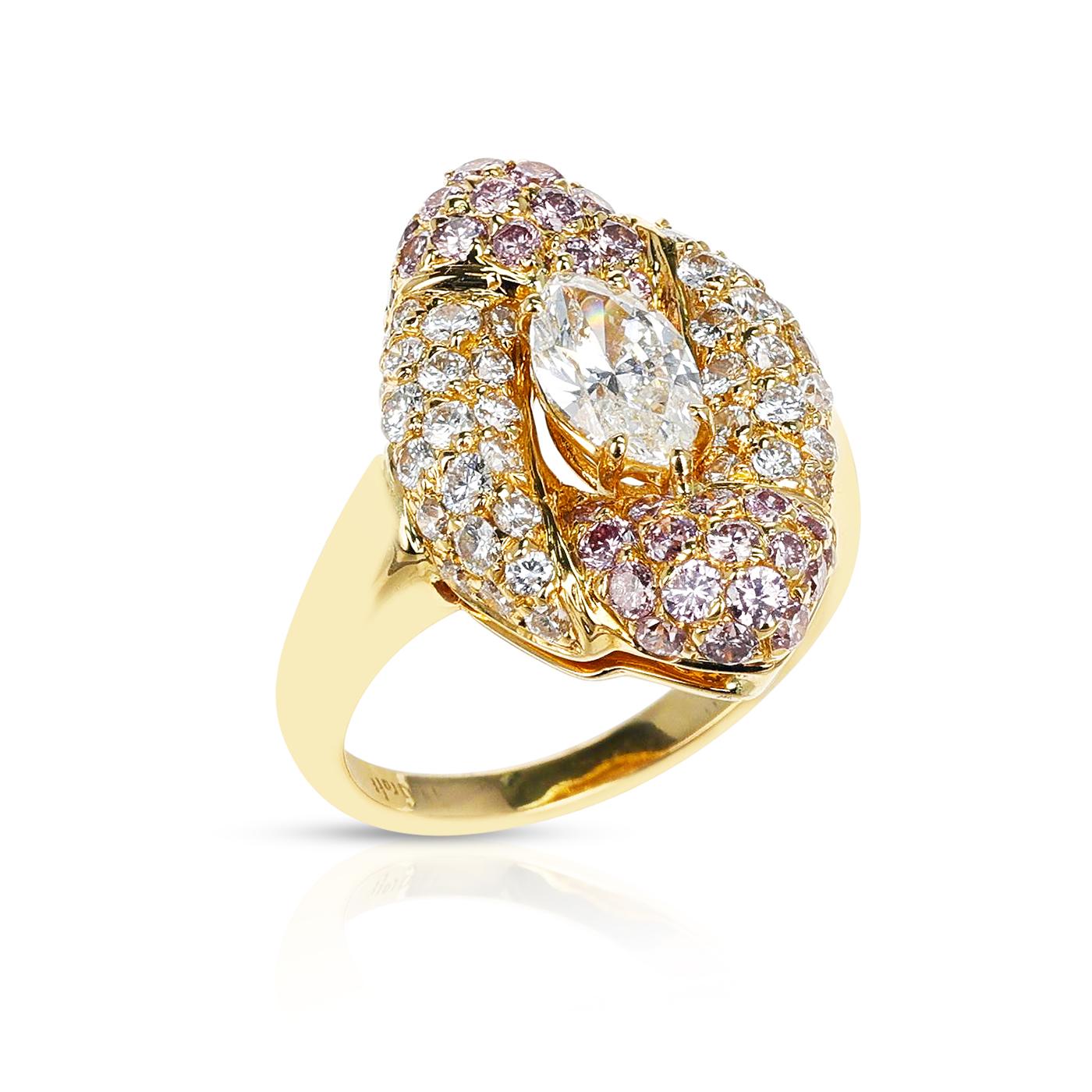 A stunning Graff GIA Certified 0.74 carat Marquise Ring with Round White and Pink Diamonds, made in 18 Karat Yellow Gold. The GIA Certificate states that the 0.74 carat Marquise Diamond is F color and VS1 clarity. There are appx. 0.41 Carats of