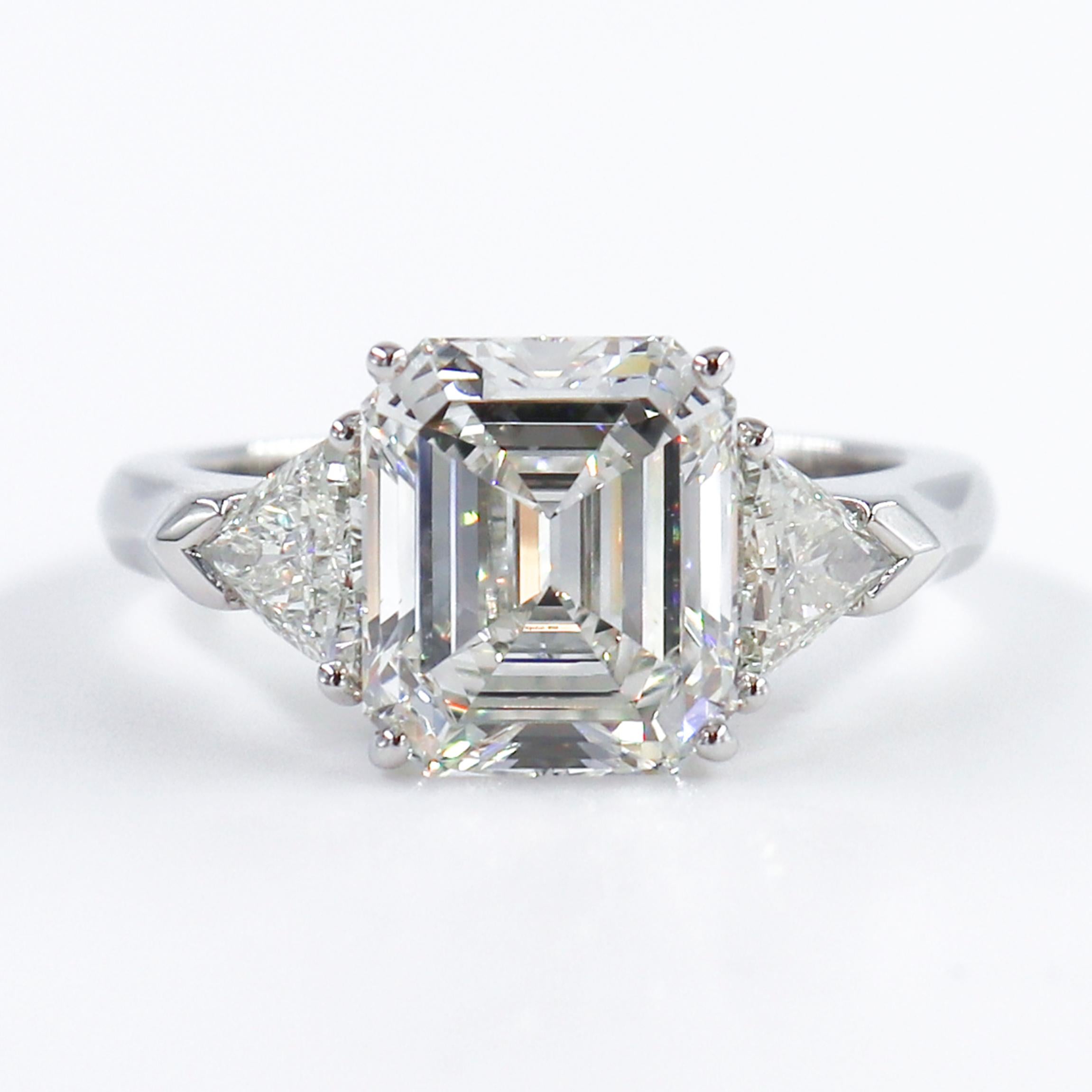 This stunning Graff ring crafted in platinum features a 3.06 carat Emerald Cut Diamond with I color and VS1 clarity surrounded by two trillions weighing .60 carats.

This ring is a size US 5.25. And stamped PT950, serial number, and Graff.