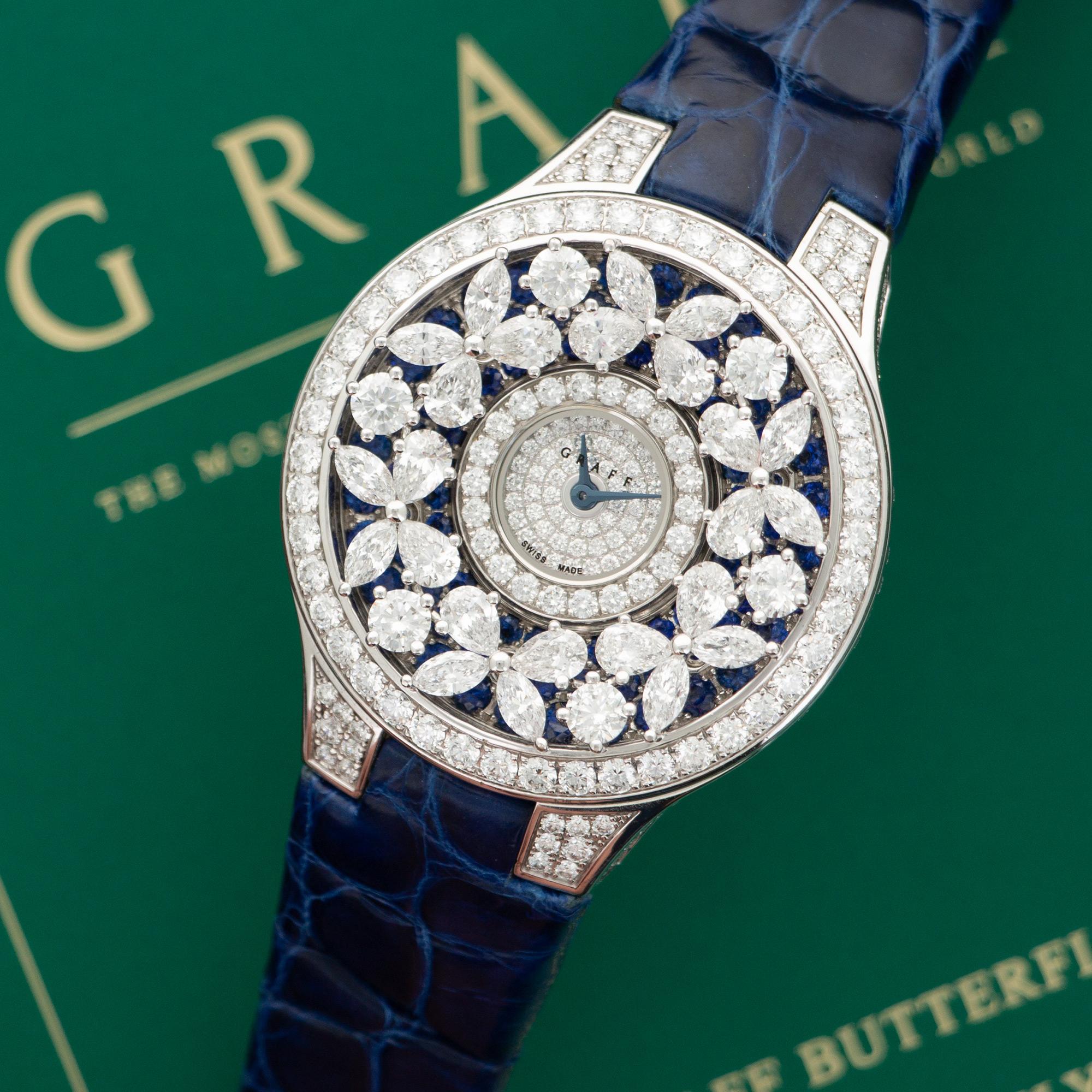 An 18k White Gold Diamond & Sapphire Strap Watch by Graff. From the Butterfly Collection. Model BF32WGED.