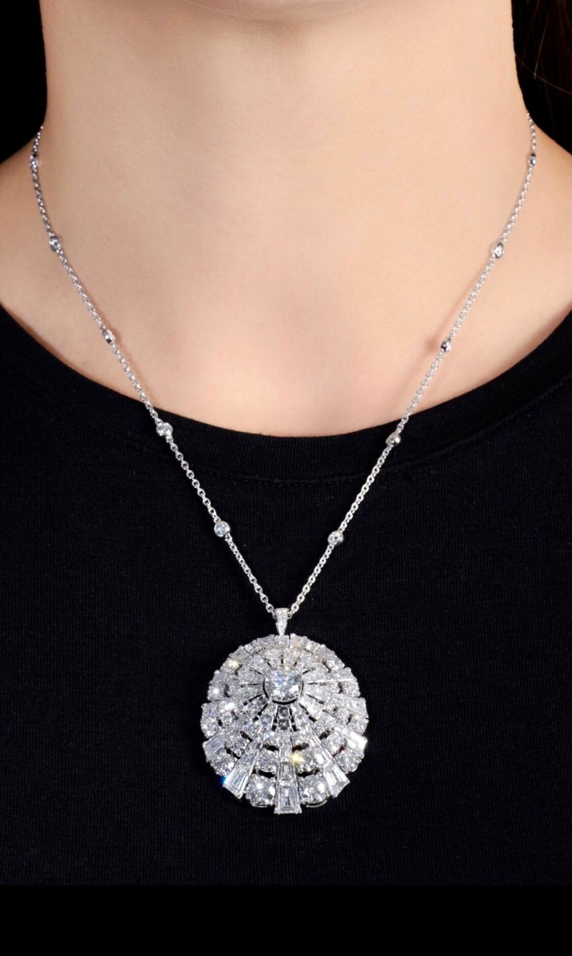 An incredible Graff diamond necklace showcasing round brilliant cut diamonds and baguette diamonds in 18k white gold. The necklace is accompanied by GIA stating that the central round brilliant-cut diamond weighing 1.52 carats, G Color, VVS2