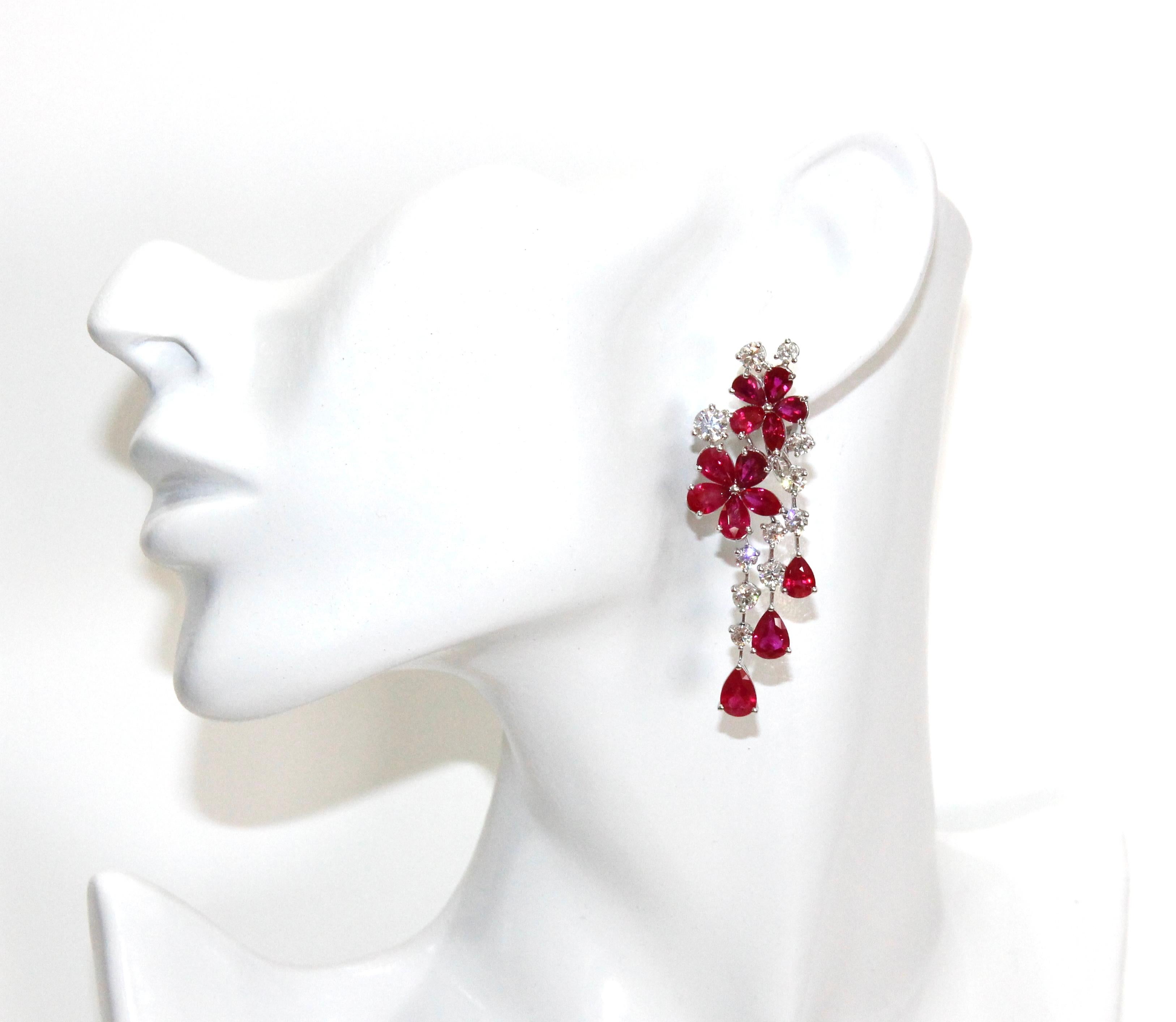 Graff Multi-Shape Ruby and White Diamond Double Flower Carissa Earrings.

22 White Round Diamonds (4cts Total)
22 Pear Shaped Rubies (18cts Total) 
4 Marquise Rubies (2.5cts Total) 
Retail: $180,000.00 