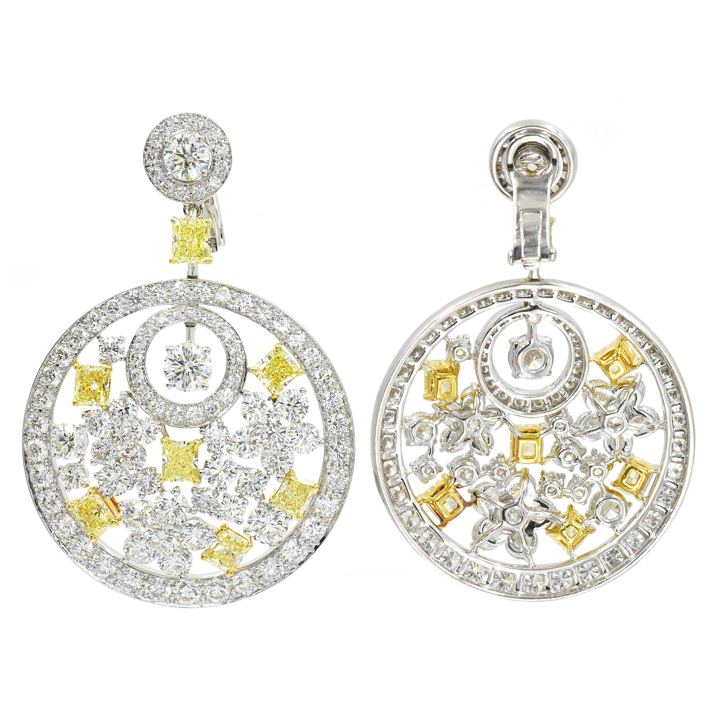 Graff Pair of  Diamond and Fancy Colored Diamond Pendant- Ear-clips This pair of earrings is topped by 2 round diamonds encircled by round diamonds, joined by 2 rectangular modified brilliant yellow diamonds, suspending large round diamond-set white