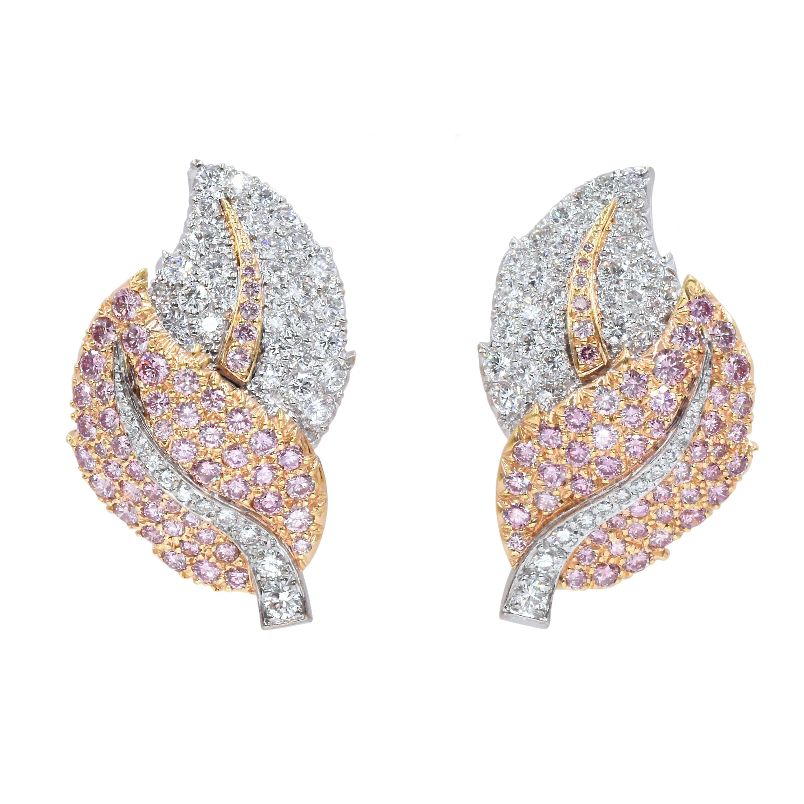 Beautiful double leaf style earrings by Graff. 

112 brilliant colorless diamonds, with total weight of 3 carats.
106 Pink brilliant cut diamonds with total weight of 3.1

With makers signature: GRAFF

18k white gold & rose