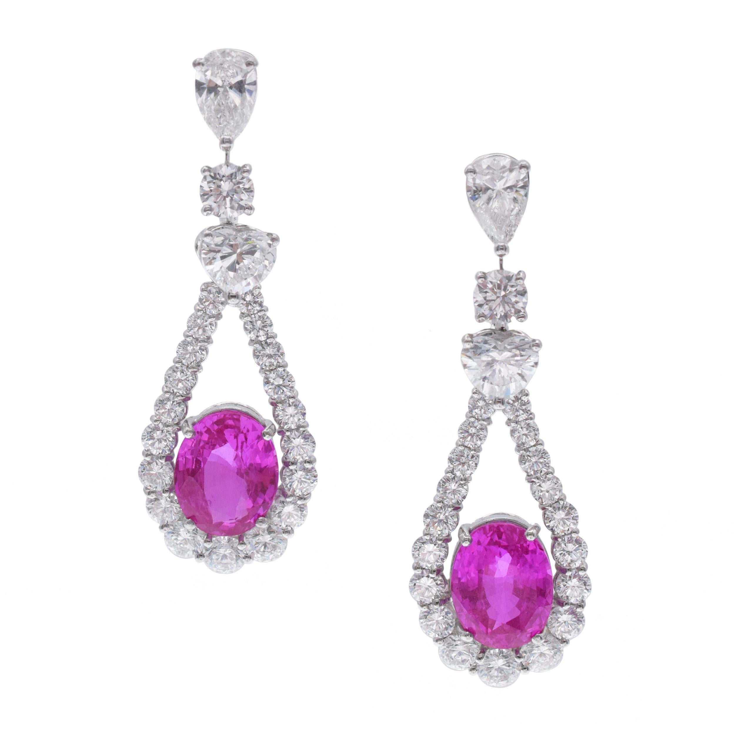 Graff Pink Sapphire And Diamond Pendant Earrings In Platinum And 18k White Gold. 
The earrings have tops set with pear and round cut diamonds, completed with open design teardrop shaped pendants  encrusted with graduating in size round brilliant cut