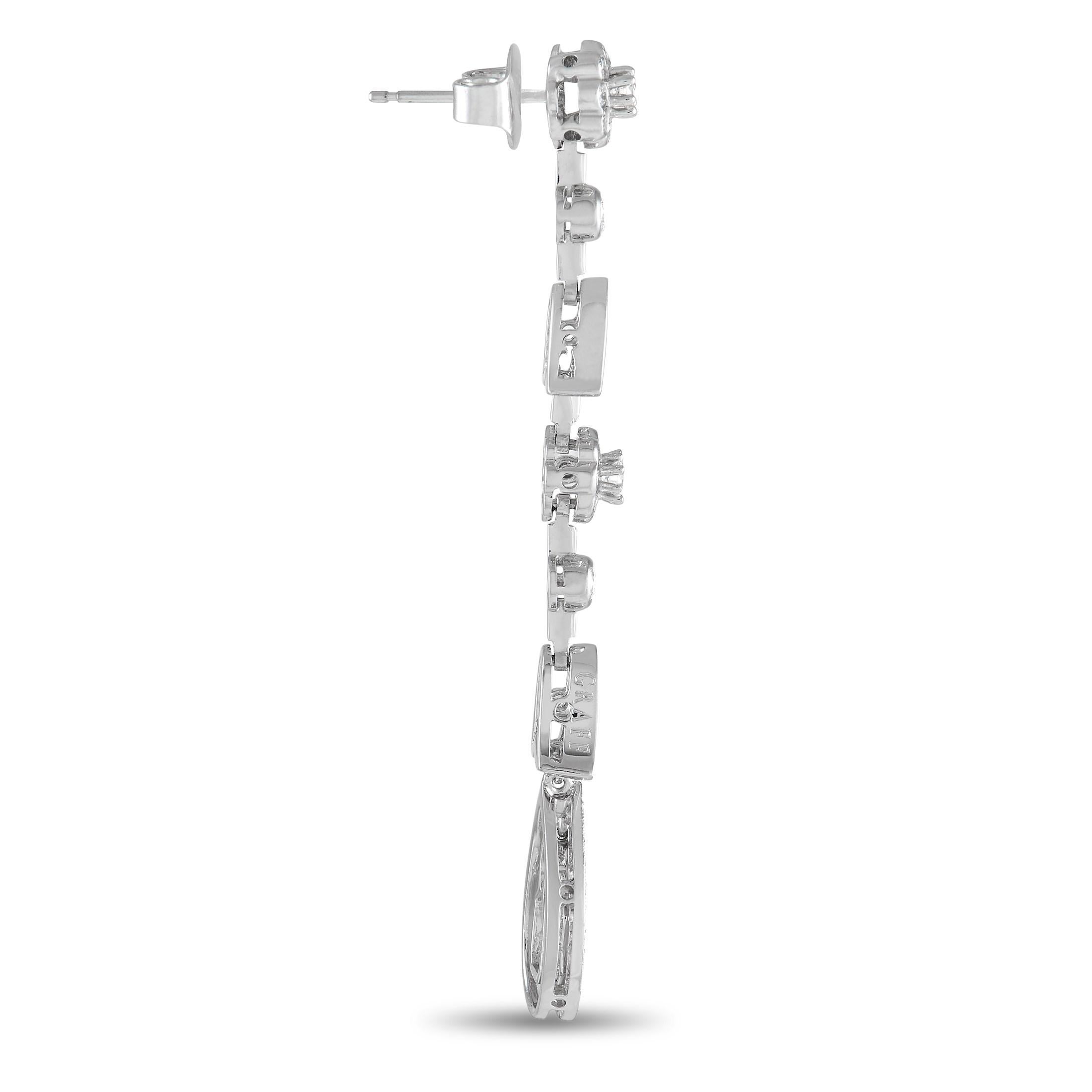 Make any outfit blossom with elegance by wearing this Graff platinum tulip chandelier earrings. Dropping from the earlobe is a platinum strand with a floral motif and 3.00 carat diamond embellishment. The diamonds have an E color grade and VVS