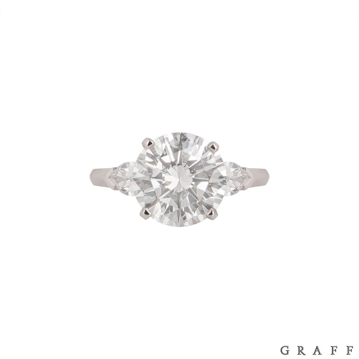 A stunning diamond ring by Graff from the Promise collection. The ring comprises of a round brilliant cut diamond with a single pear shaped diamond on each side in a claw setting. The round brilliant cut diamond has weight of 4.04ct, I colour and