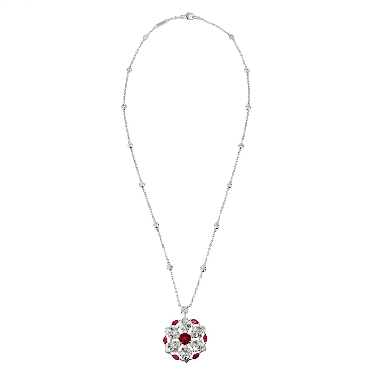 A fabulous Graff Ruby and Diamond necklace showcasing a pendant set with brilliant-cut diamonds, marquise-cut rubies and a central circular-cut ruby, on a cable link chain adorned with round brilliant cut diamond stations. The necklace is mounted in