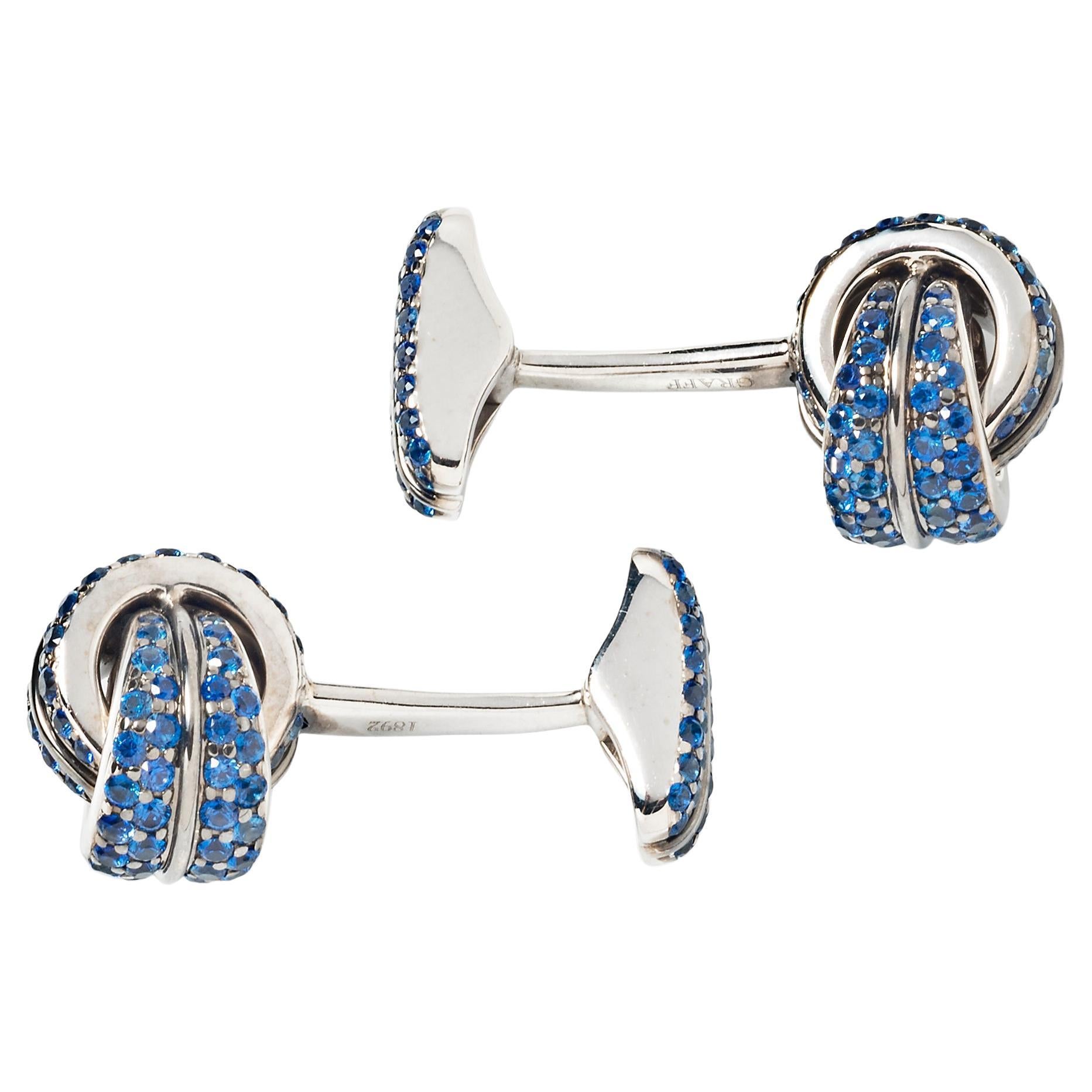 An elegant finishing touch for the well-dressed man, these Graff cufflinks feature deep blue channel-set sapphires mounted in 18k white gold.

Approximately 3.90 carats of sapphire 
18k white gold 
1.25 x .375” 
Signed Graff