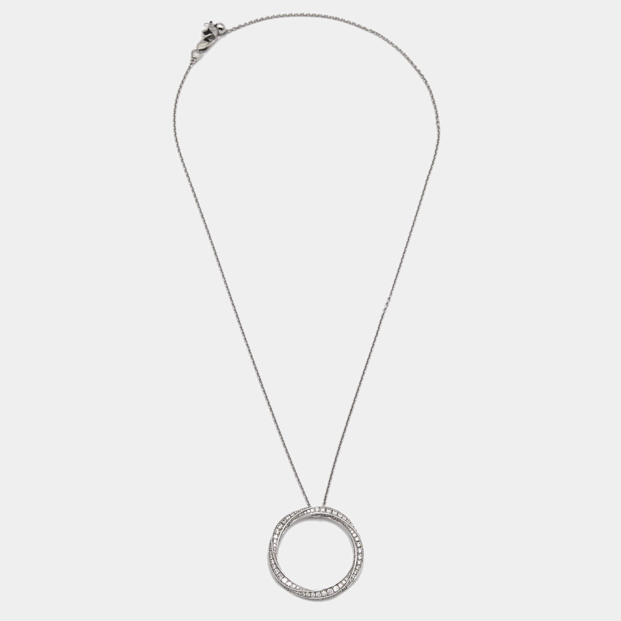 Modern, chic, and minimal, this Graff necklace is made for the woman of today! The pendant has been sculpted using 18k white gold and studded with carefully-placed diamonds on its smooth surface. The slender chain comes with a lobster