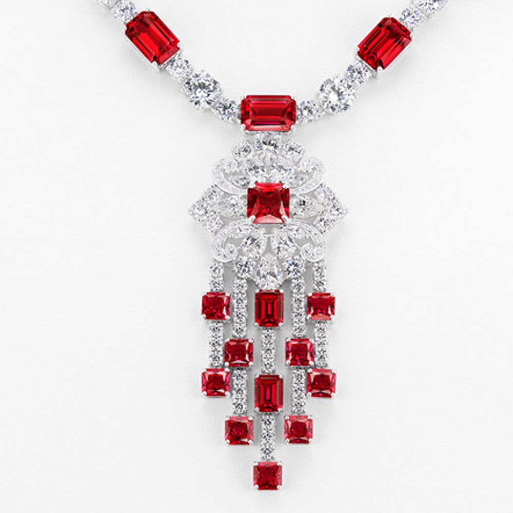 Graff Style Diamond Ruby Costume Jewelry Pendant Necklace by Clive Kandel

Very real-looking Graff-style mand-made gems, diamonds, and rubies set in platinum-looking rhodium sterling silver, all hand-set precisely like the genuine $1,000,000 real