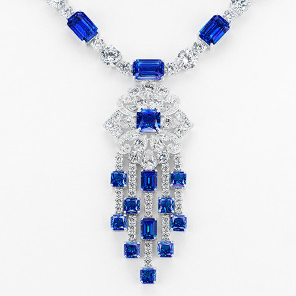 Art Deco  Diamond Sapphire Costume Jewelry Pendant Necklace by Clive Kandel

Very real-looking Graff-style mand-made gems, diamonds, and sapphires set in platinum-looking rhodium sterling silver, all hand-set precisely like the genuine $1,000,000
