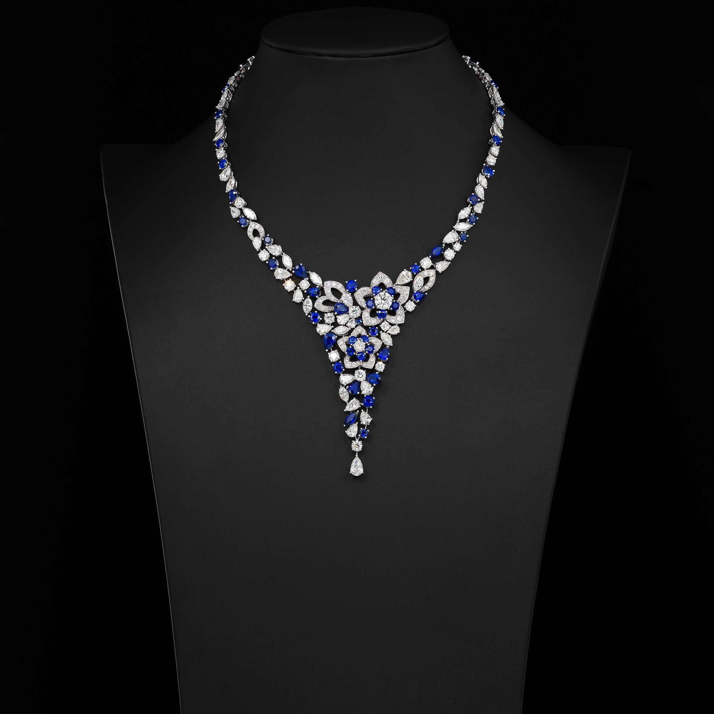 Sensational Graff necklace of floral inspiration and showcasing 33.3 carats of finest white diamonds (approximately D to G color, VVS to VS clarity) and 25.3 carats of richly saturated blue sapphires, all masterfully set in 18 karat white gold. The