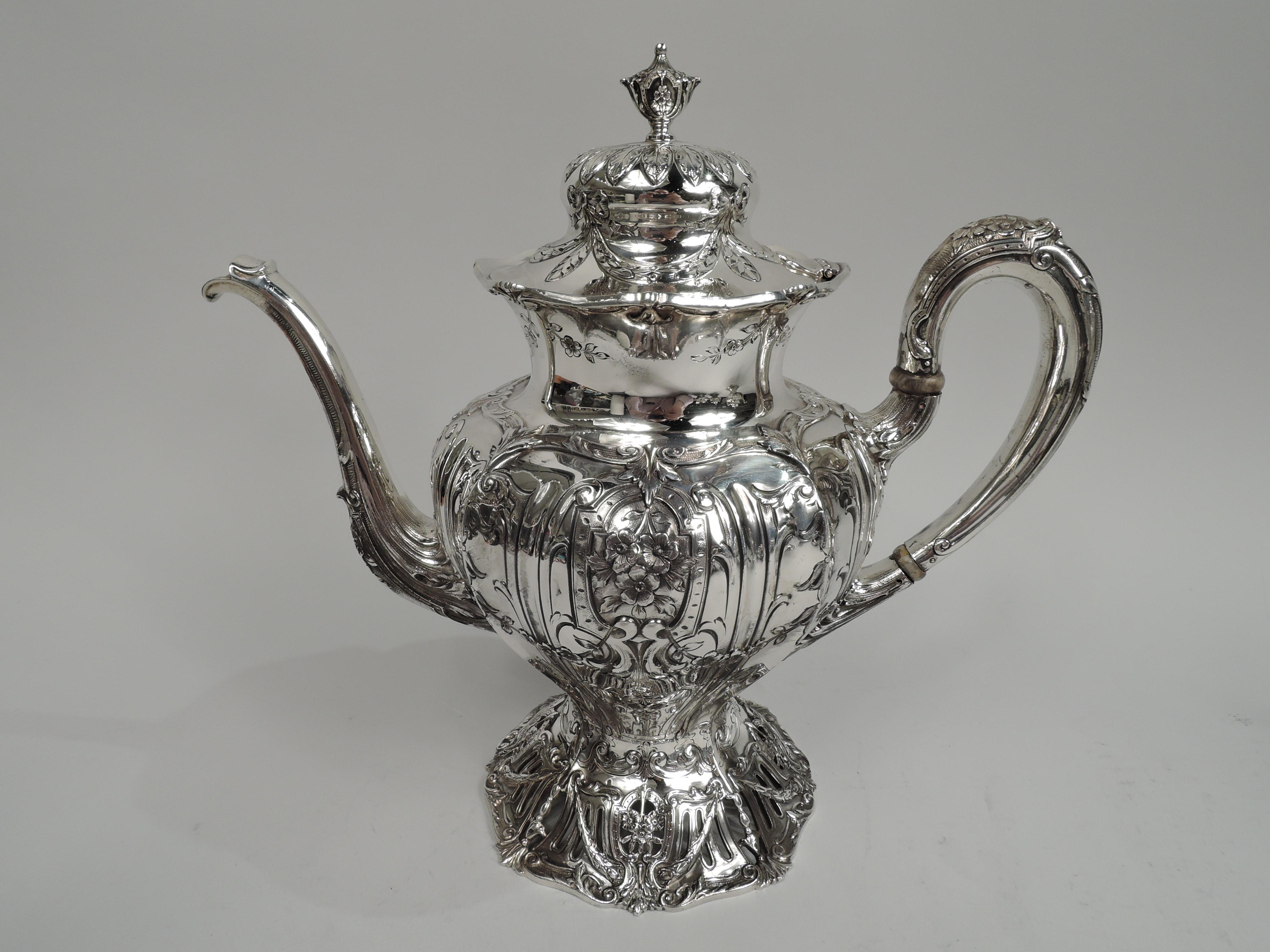 Edwardian Regency sterling silver 5-piece coffee and tea set on tray. Made by Graff, Washbourne & Dunn in New York, ca 1909. This set comprises coffeepot, teapot, creamer, sugar, and waste bowl on tray. Ovoid bodies, high-looping handles, double