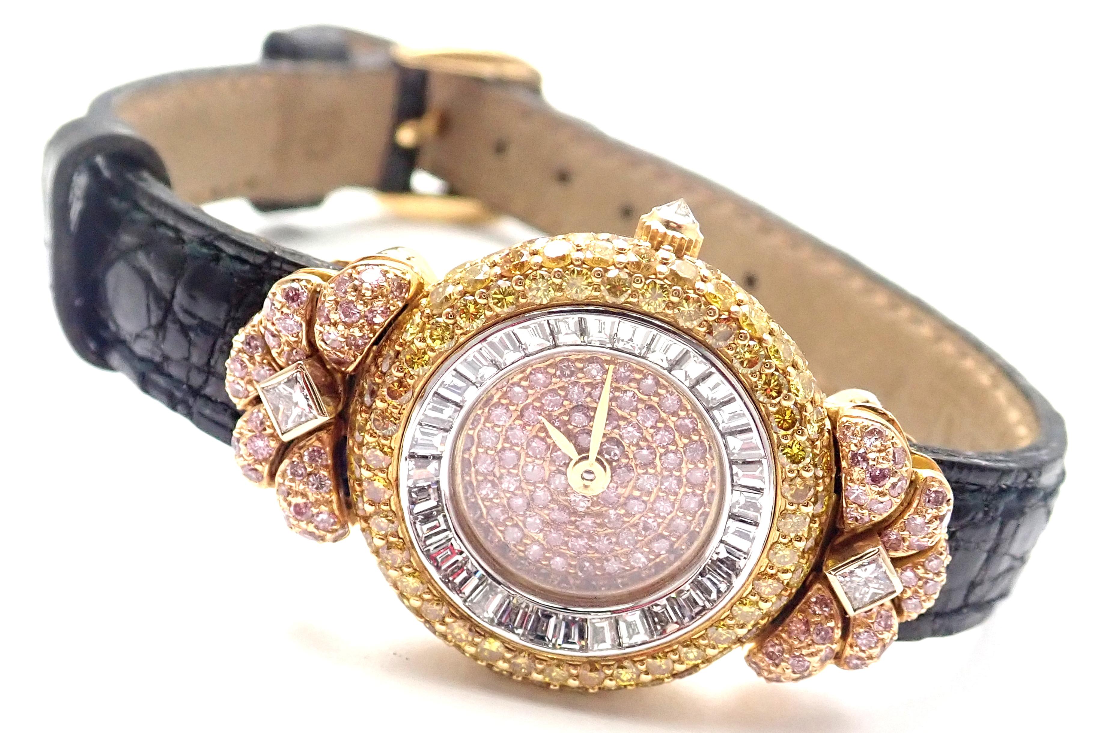 18k Yellow Gold White, Pink and Yellow Diamond Ladies Wristwatch by Graff.
With Round Pink diamond dial
Pink, yellow and white diamonds
Round brilliant cut, 2 princess cut and emerald cut diamonds.
Details: 
18k Yellow gold case with a black leather