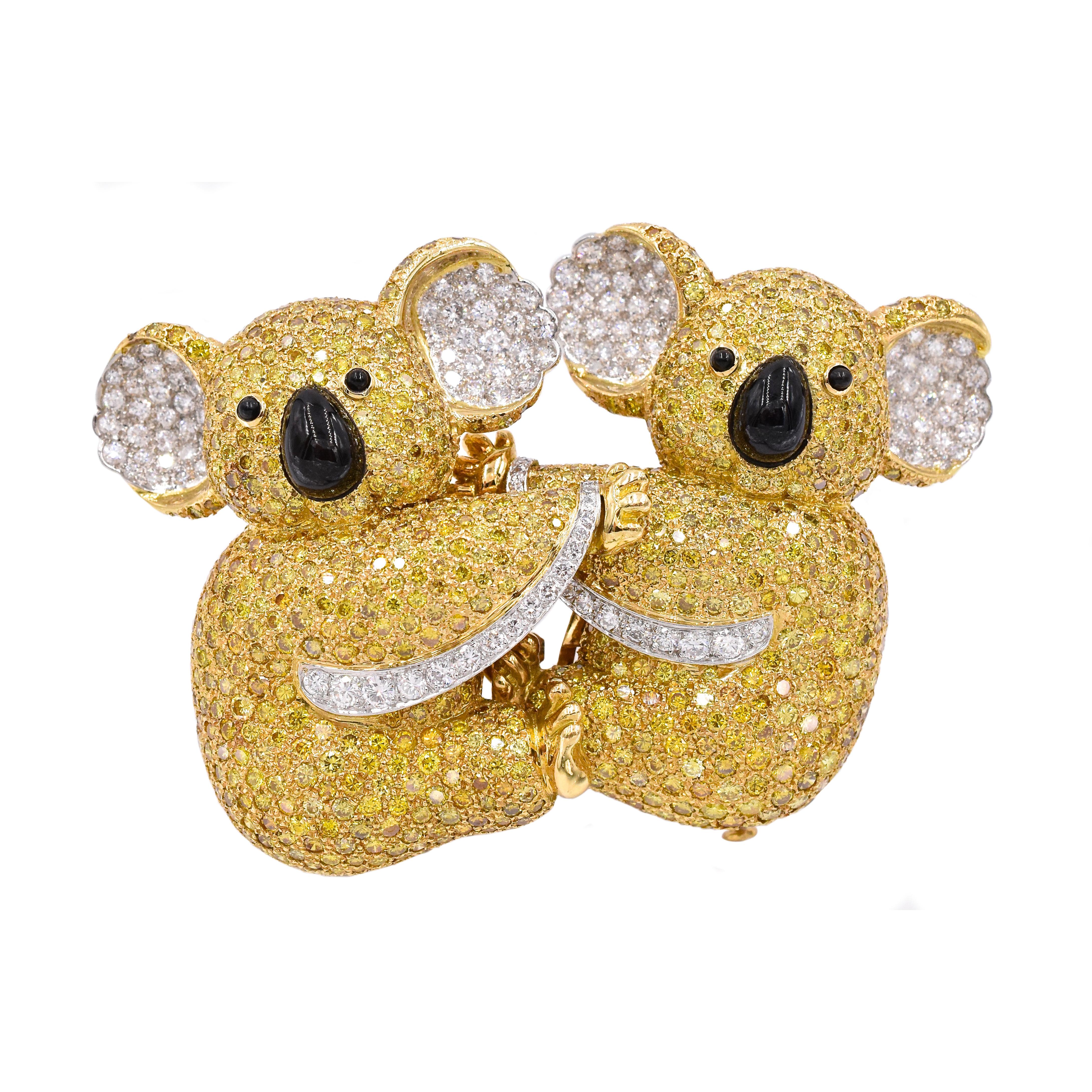 Adorable! Double Koala bear  brooch by Graff!
Fancy yellow & colorless diamonds with estimated weight of 19.75 carats
Yellow diamonds range from fancy yellow to vivid yellow color.
Eyes & nose is set with cabochon onyx.
With makers hallmark: