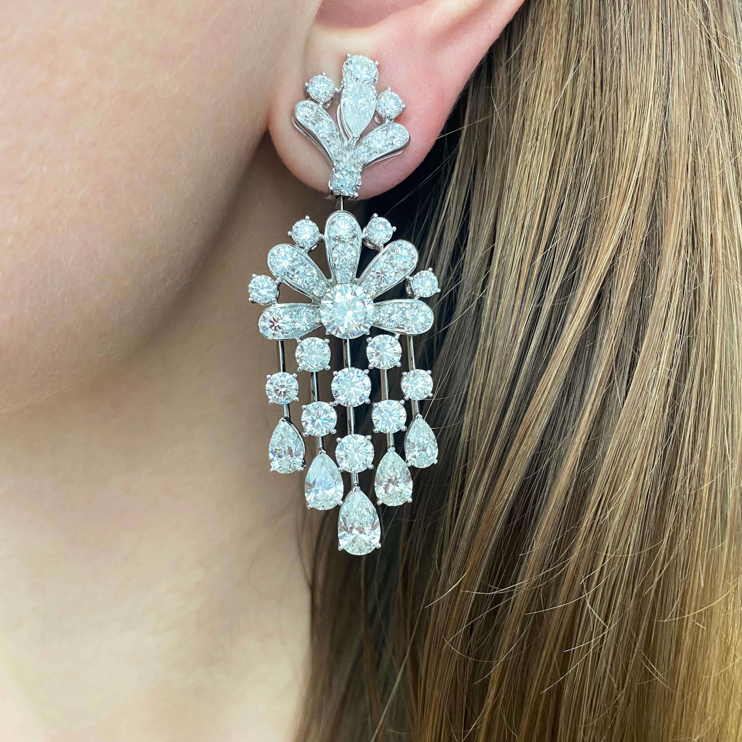 GRAFFf Pair of Platinum and Diamond 'Waterfall' Pendant-Earrings The pair of earrings are topped by a stylized fan motif of 2 marquise-shaped and 20 round diamonds, suspending a flower motif centering 2 round GIA Certified diamonds 2.54 carats
