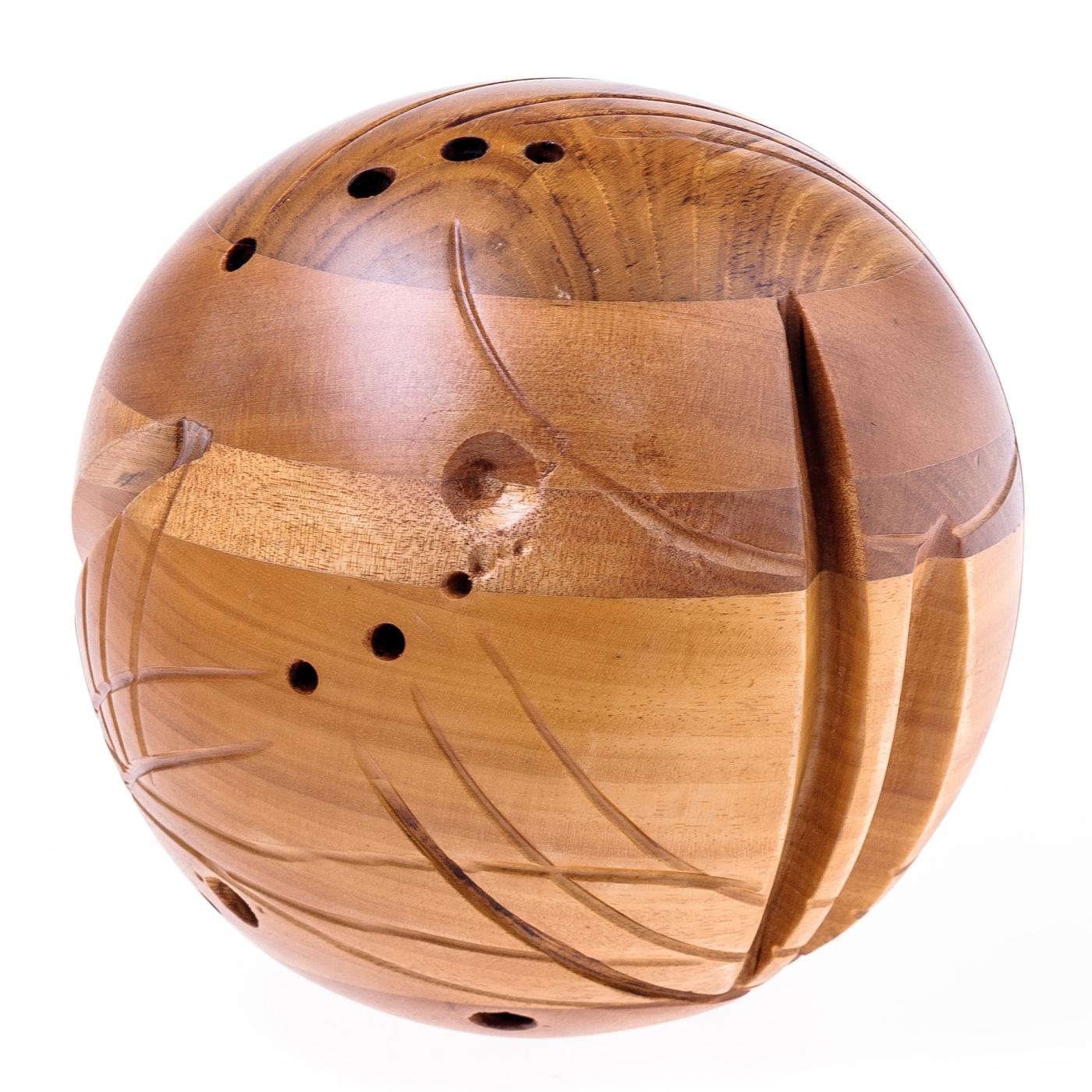 Unconventional and masterfully well-crafted, this spherical sculpture is a testament to the versatility and ageless beauty of wood. Crafted entirely by hand, layers European woods (ash, walnut and chestnut) are hand assembled, carved, and polished