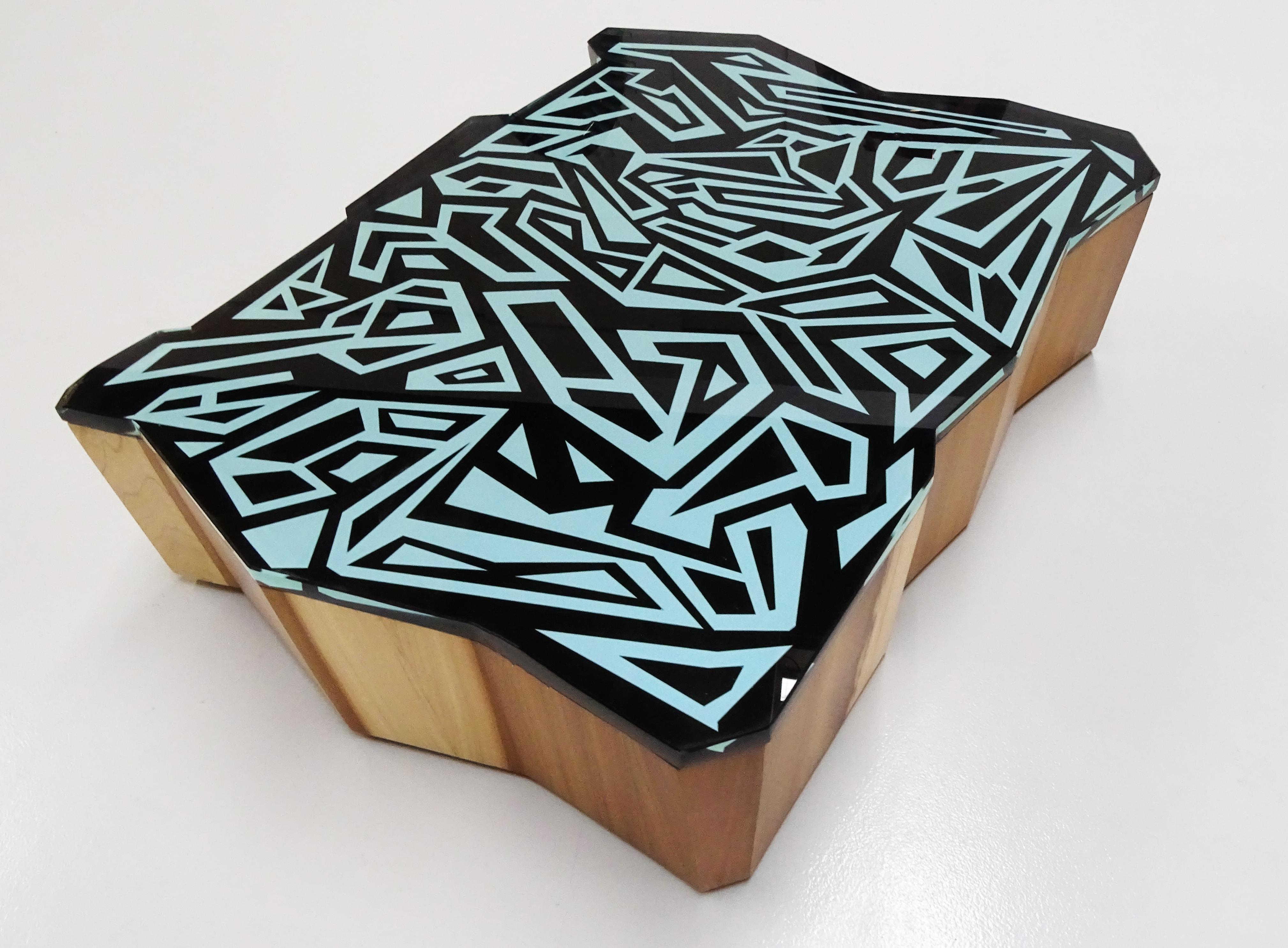 Sculptural coffee table from the collection '' graffiti '' made with hand carved wood and glass, unique piece.