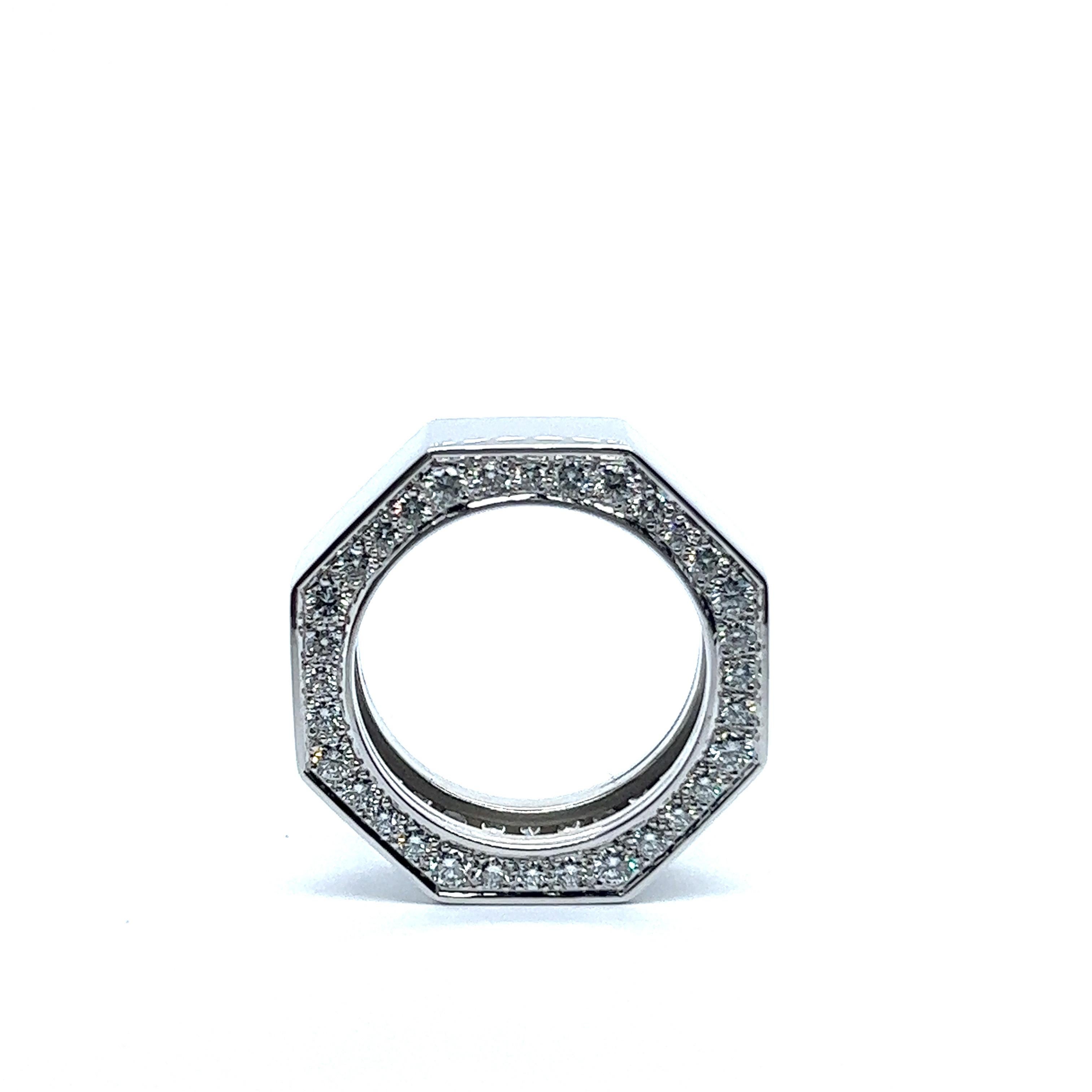 Bold and undeniably fashionable 18 Karat white gold octagonal grafik ring. This show-stopping piece is adorned with a stunning array of 64 brilliant-cut diamonds, boasting a dazzling G-H color and vs-si clarity, totaling an impressive 2.20 carats.