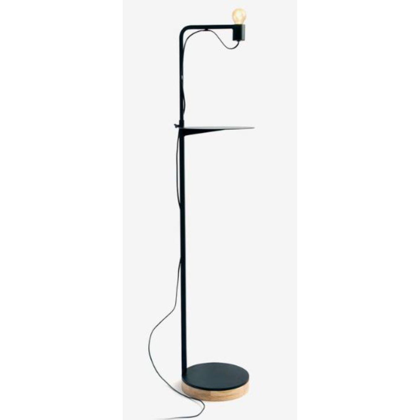 Grafit floor lamp with shelf by RADAR
Design: Bastien Taillard
Materials: Metal, oak.
Dimensions: W 30 x D 30 x H 110-170 cm
Also available in solid oak (base).

All our lamps can be wired according to each country. If sold to the USA it will