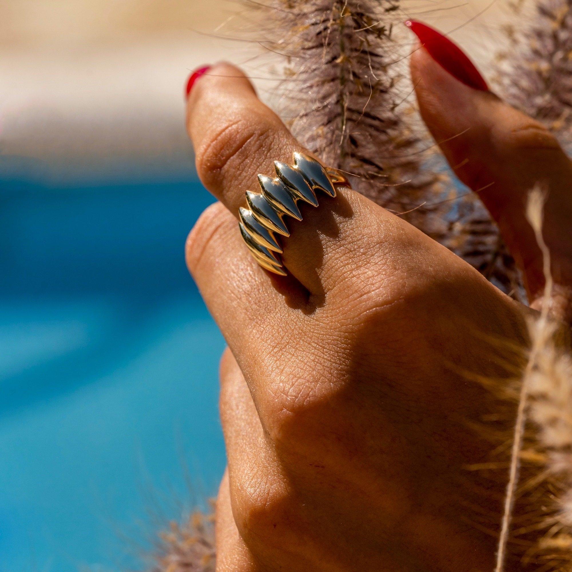 The ‘Grain array’, ring is crafted in 18K yellow gold, hallmarked in Cyprus. This stunning, sculptural ring comes in a highly polished finish and is very comfortable to wear as an everyday chevalier, middle or pointer finger ring. The ‘Grain array’,