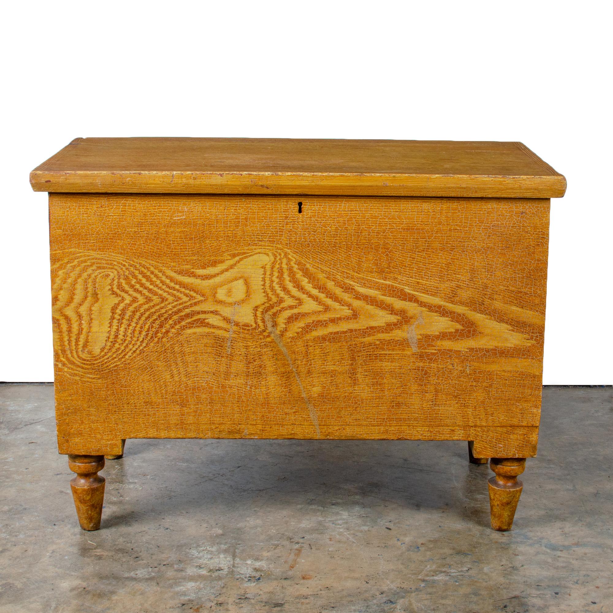 A grain painted blanket chest, Pennsylvania circa 1850.

31 ¾ inches wide by 17 ¾ inches deep by 23 ¼ inches tall

