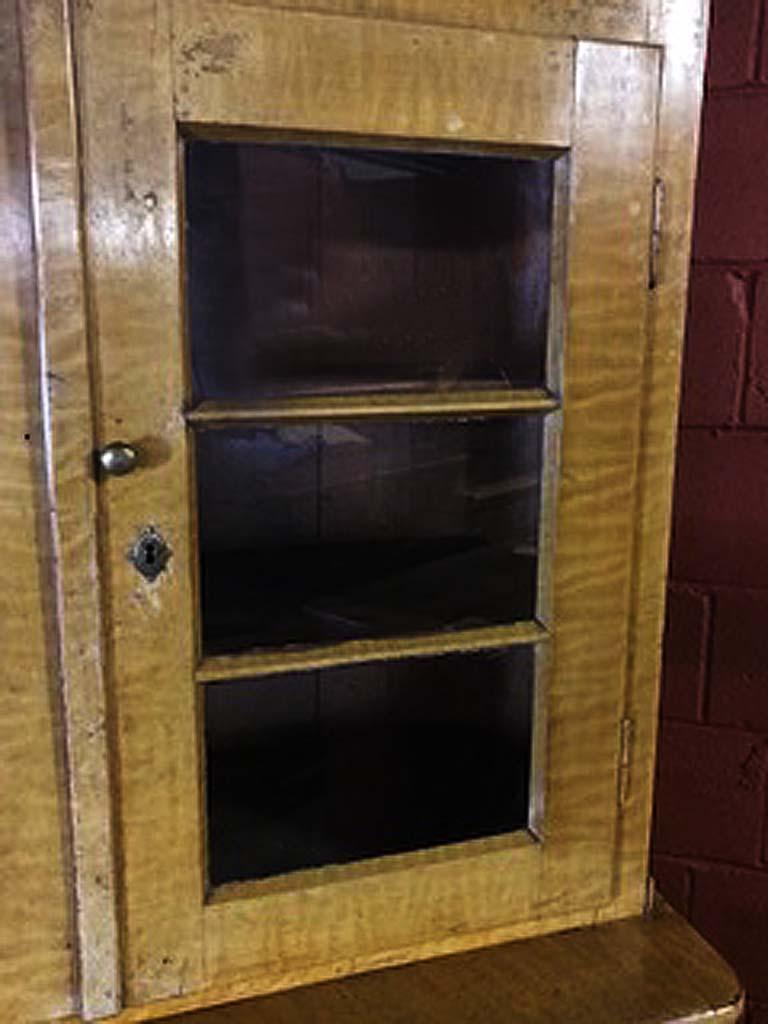 Grain Painted Eastern European Cupboard, in two sections,  with original wavy glass in upper doors, adjustable shelves, double doors in lower section, on bracket feet.  